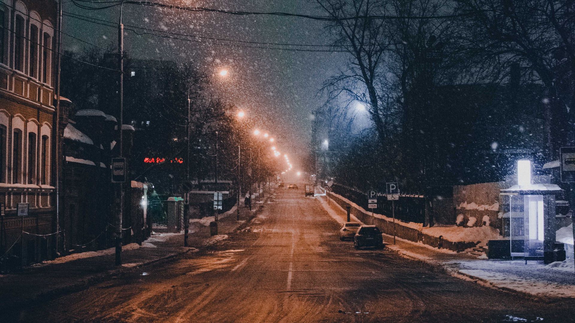 Download wallpaper 1920x1080 night city, road, snowfall, winter, twilight full hd, hdtv, fhd, 1080p HD background