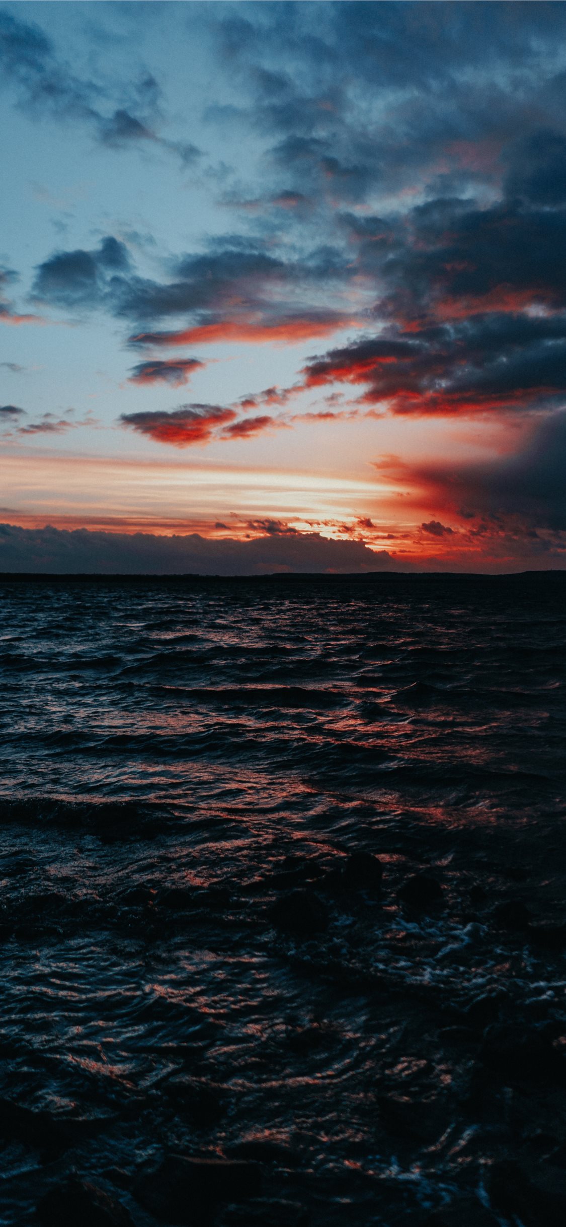 body of water under grey sky iPhone 11 Wallpaper Free Download