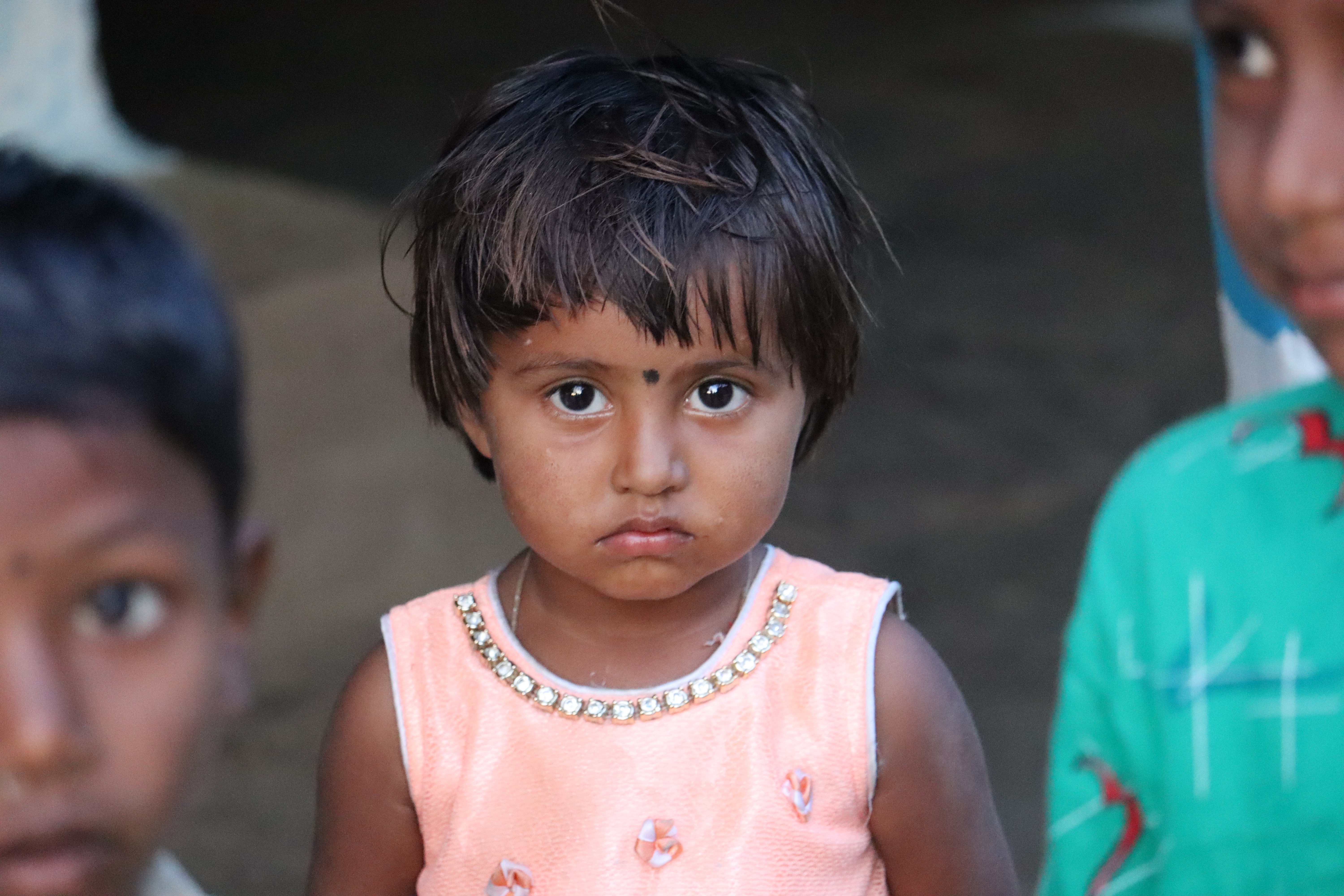 Photo of Sad Young Girl Sitting Alone by Curb · Free