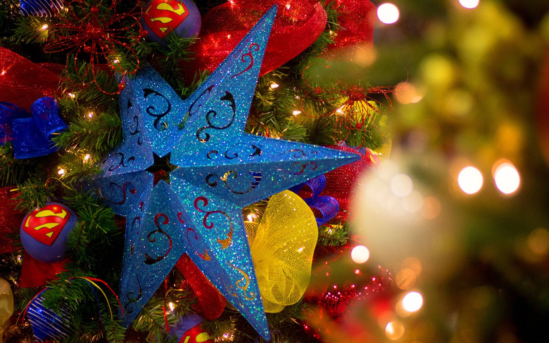 Download Blue Holiday Star On Christmas Tree Wallpaper