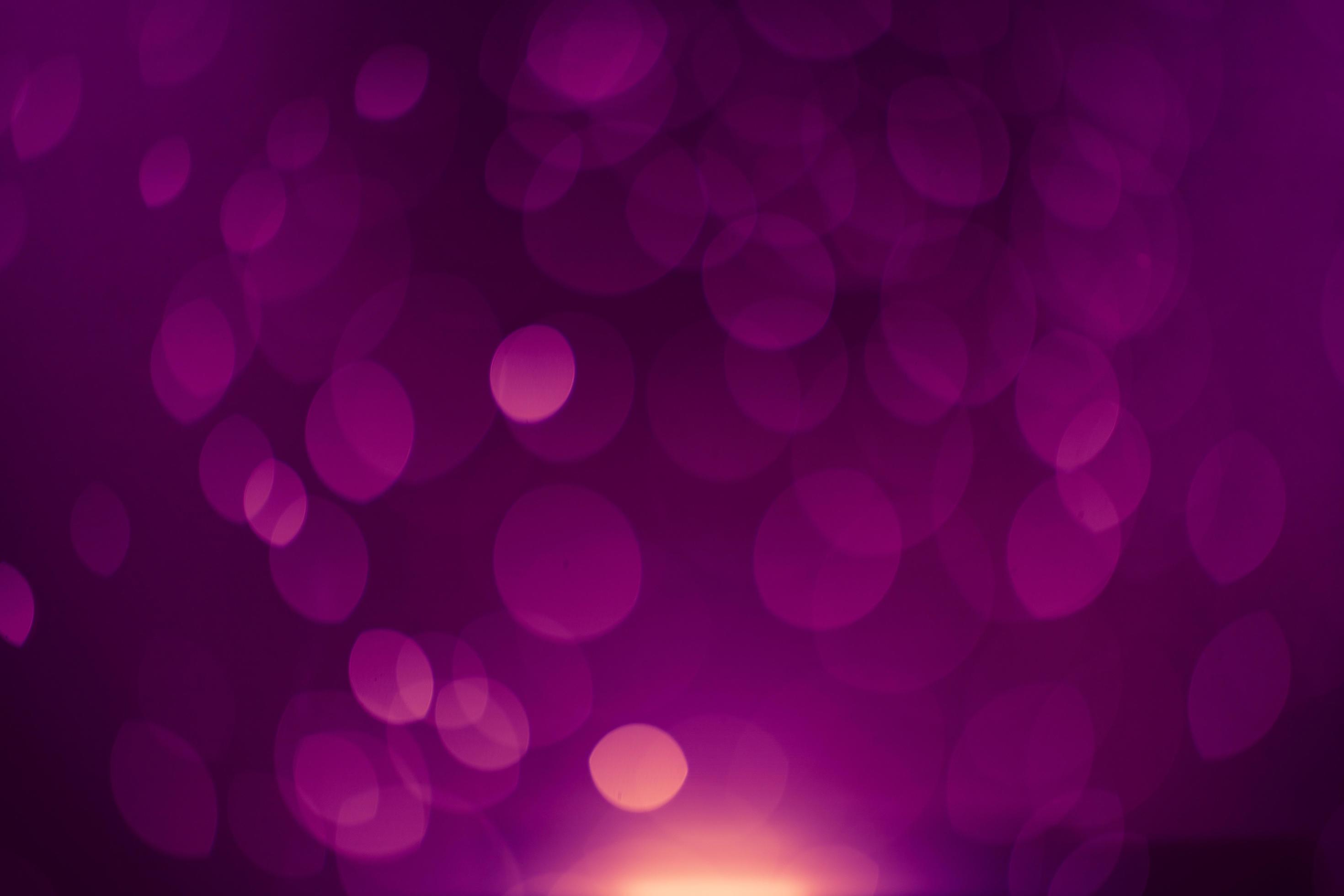Dark purple Festive Christmas Beautiful abstract Background with bokeh lights. Holiday Texture with copy space. Can be used as Wallpaper, filling for a website, defocused