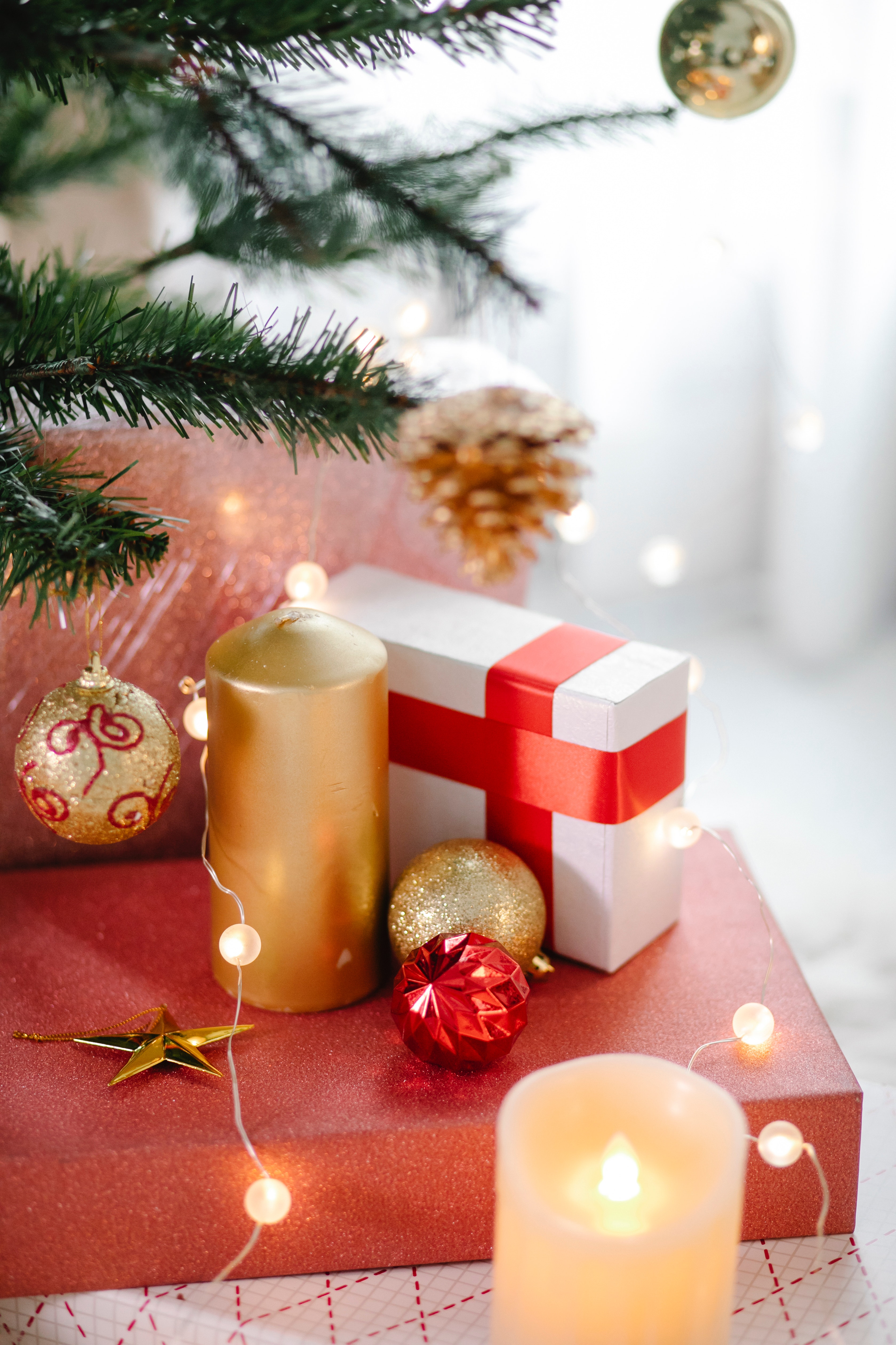 Burning candles and gift boxes during Christmas holiday · Free