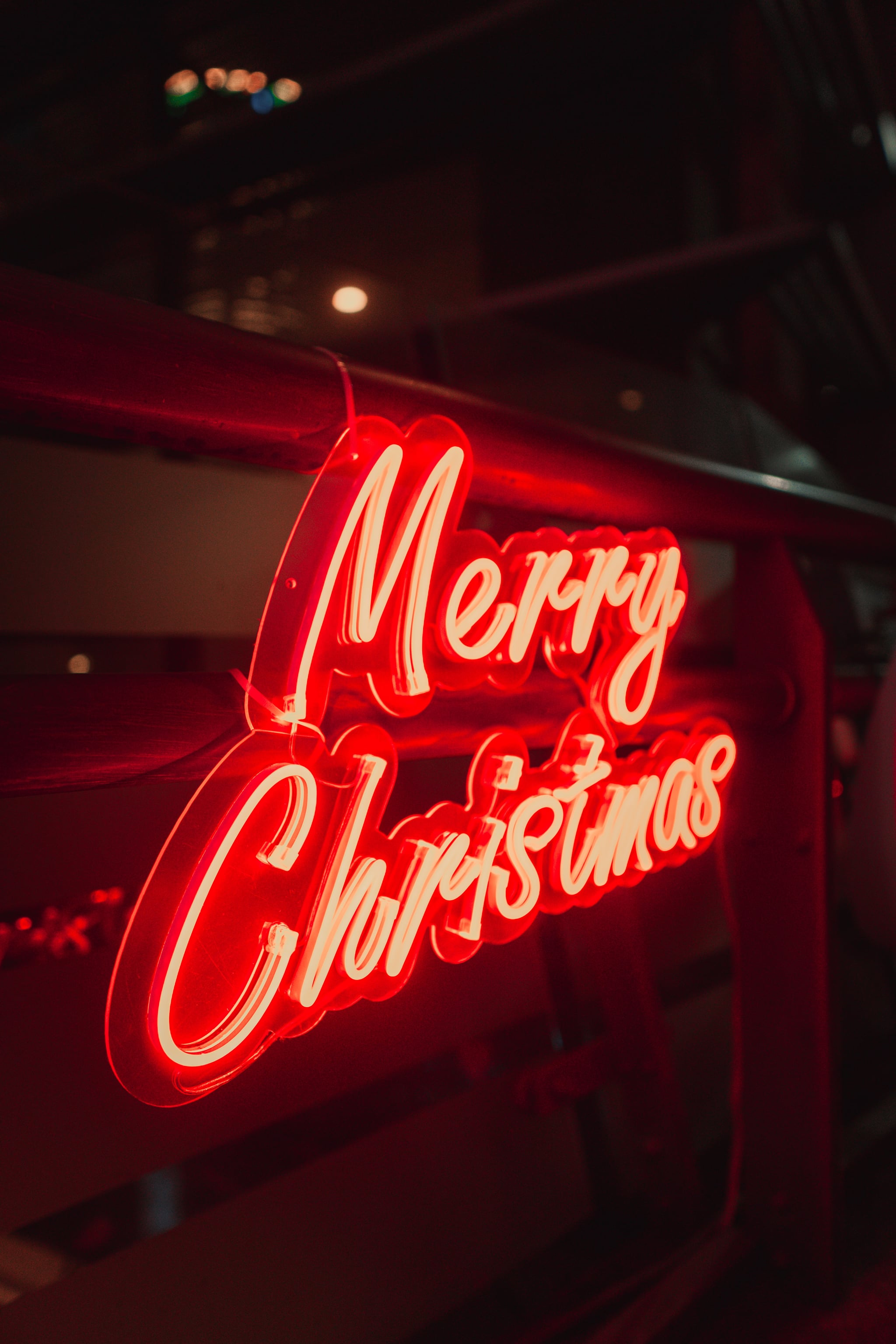 Merry Christmas Neon Sign iPhone Wallpaper Christmas Wallpaper That'll Make Your Home Screen Aesthetically Pleasing This Holiday