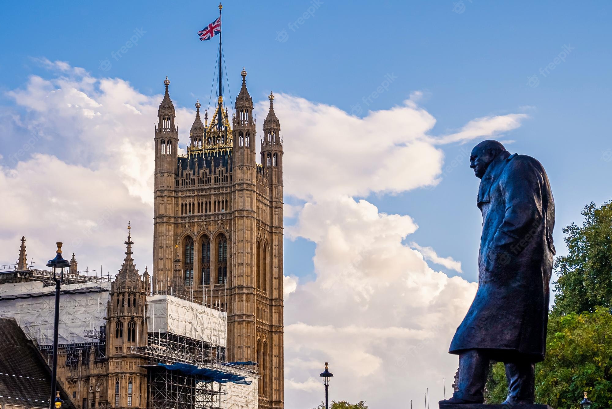 Premium Photo. Statue of sir winston churchill facing the houses of parliament in london