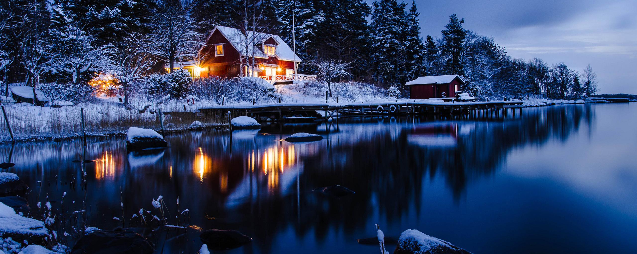 Winter holiday night at the cottage in the mountain