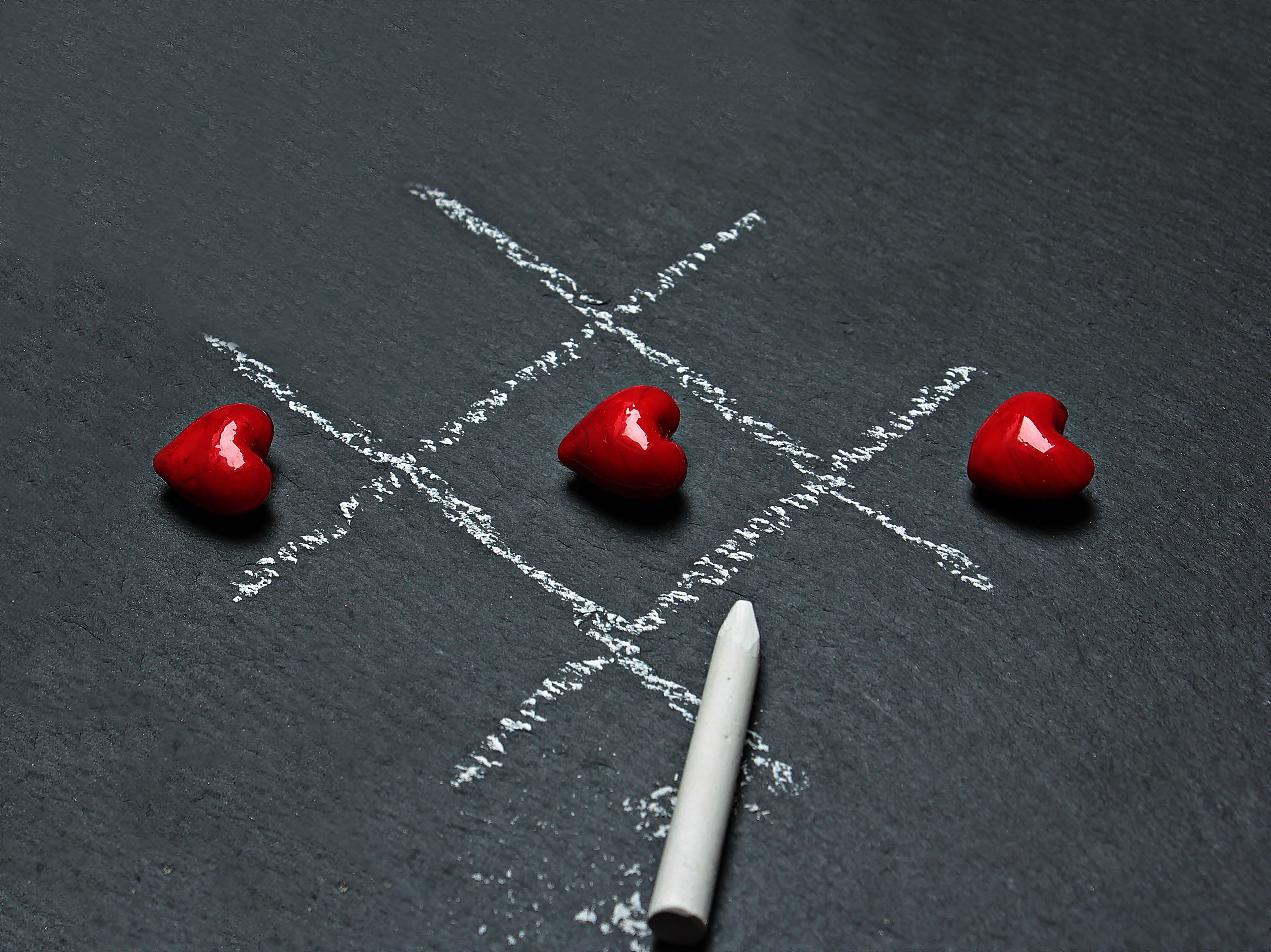 Chalk Drawn Tic Tac Toe With Three Lined Up Heart · Free