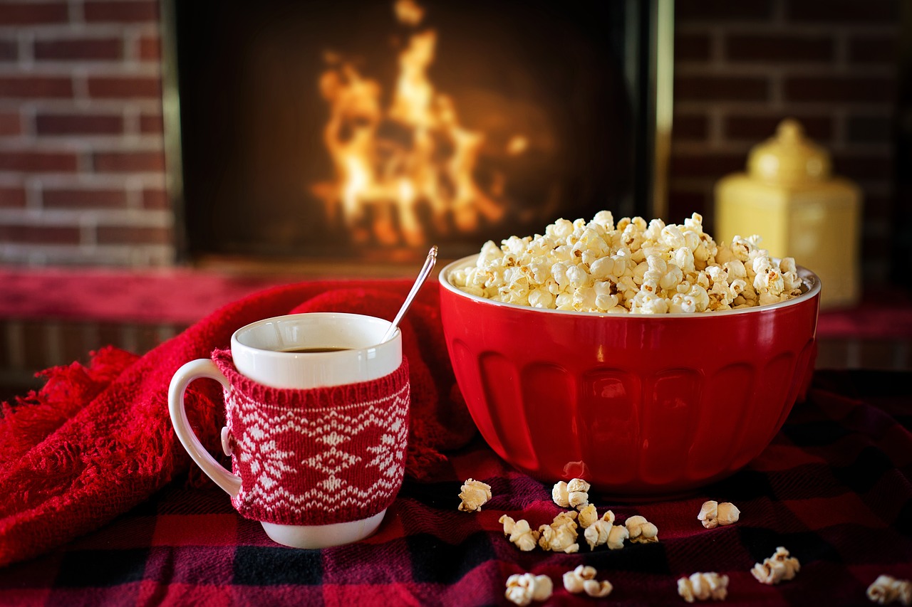 Download free photo of Warm and cozy, winter, popcorn, coffee, fire in fireplace