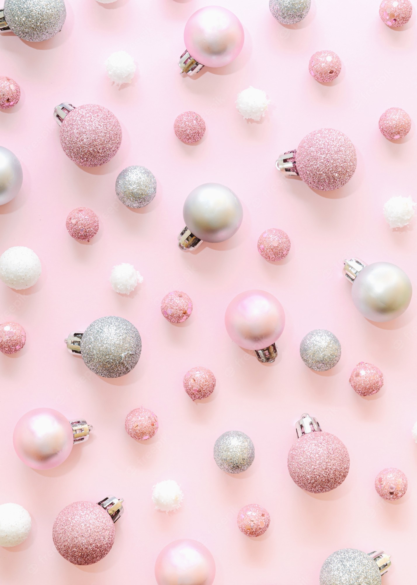 Premium Photo. Christmas background pattern made of christmas baubles. various christmas pink, silver and white balls. monochromatic new year aesthetic concept