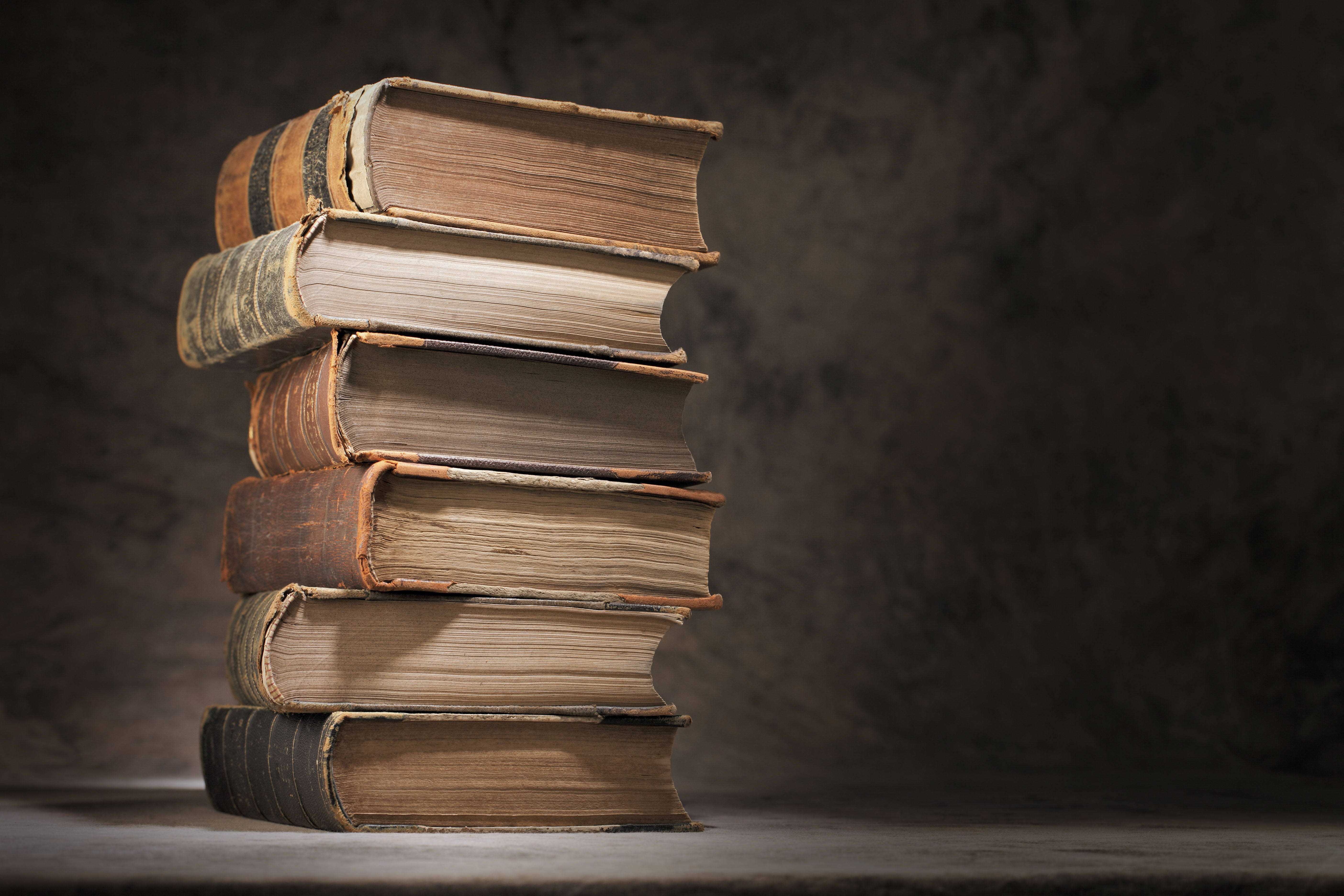 Download Stack Of Old Dictionary Books Wallpaper