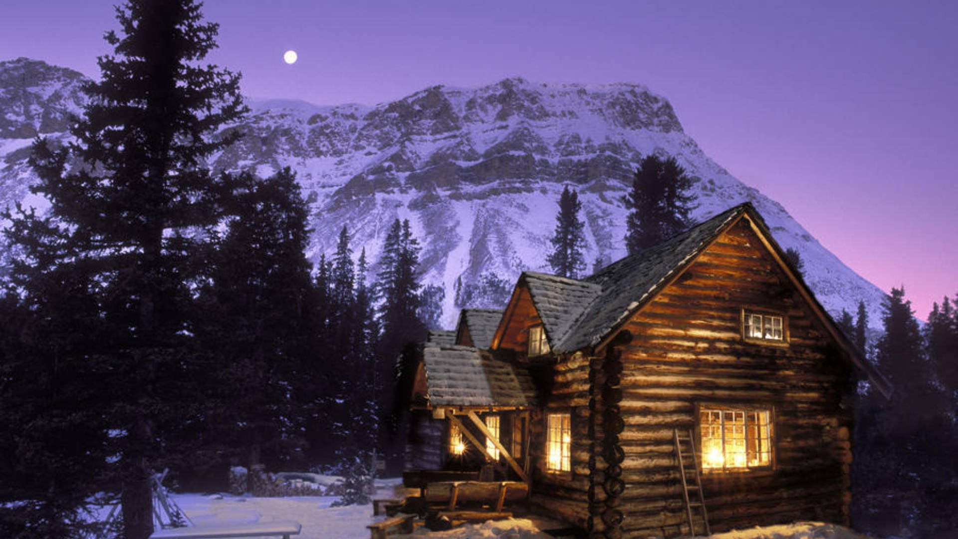 Download Snowy Mountain Behind Cozy Winter Cabin Wallpaper