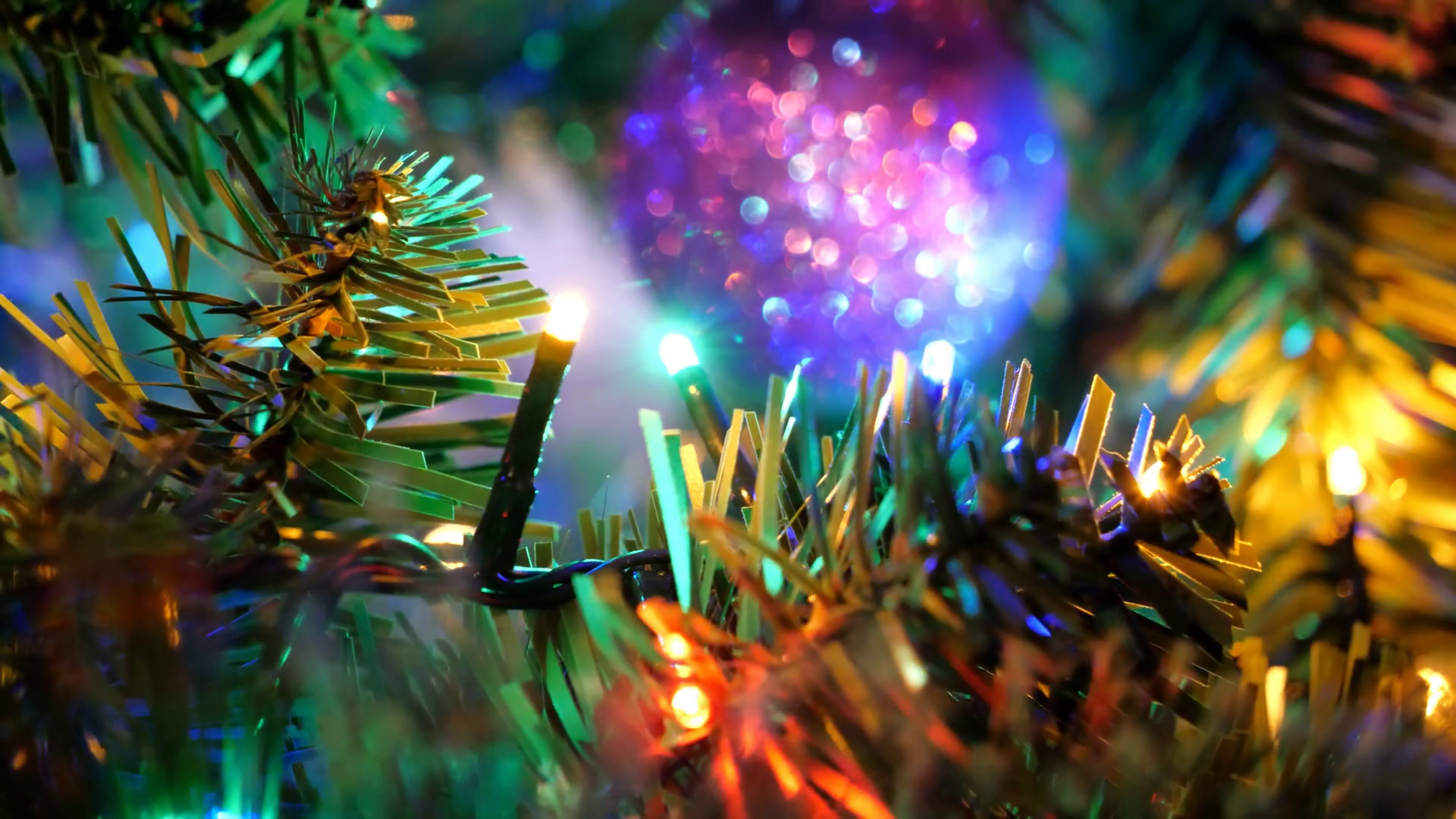 Abstract 4k Video Background Of Blinking Multi Colored Lights And Ornaments In A Christmas Tree Stock Video Footage 00:19 SBV 338964445