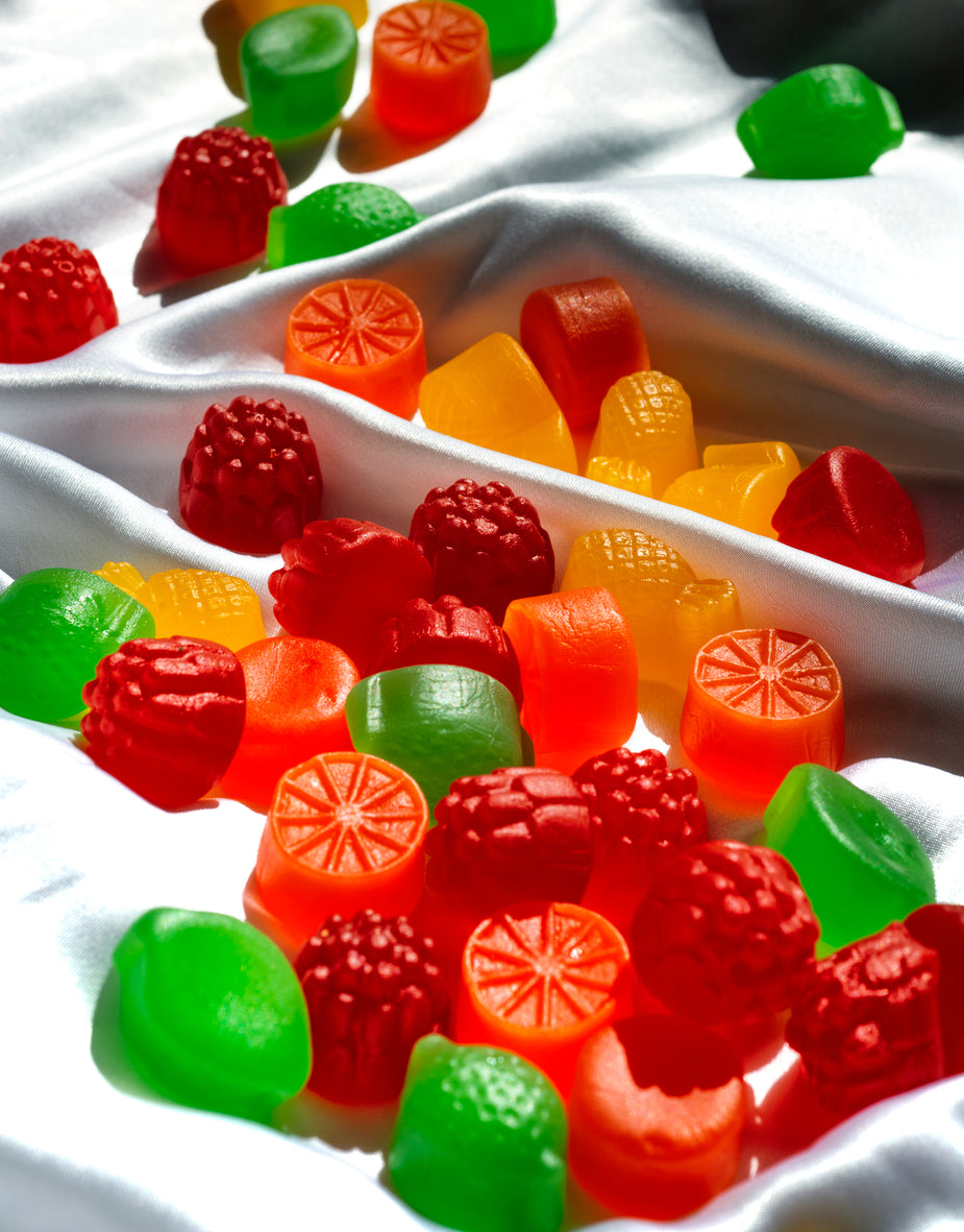 Browse Free HD Image of Colorful Candy On White Silk Fabric