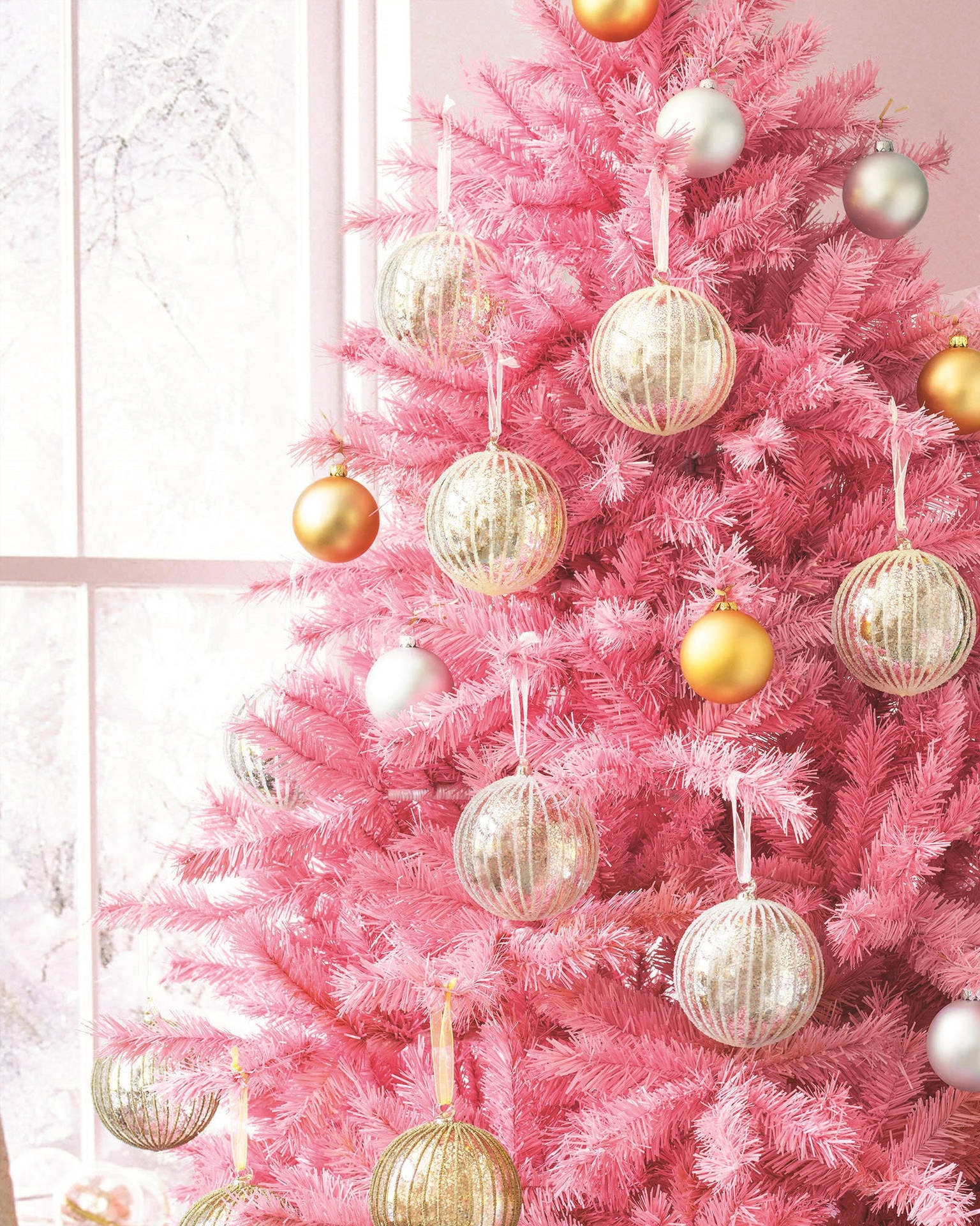 Download Pretty Pink Christmas Tree With Baubles Wallpaper