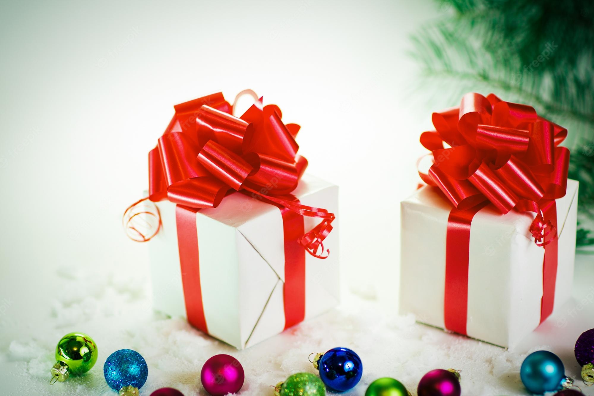 Premium Photo. Gift boxes and christmas toys on a light background