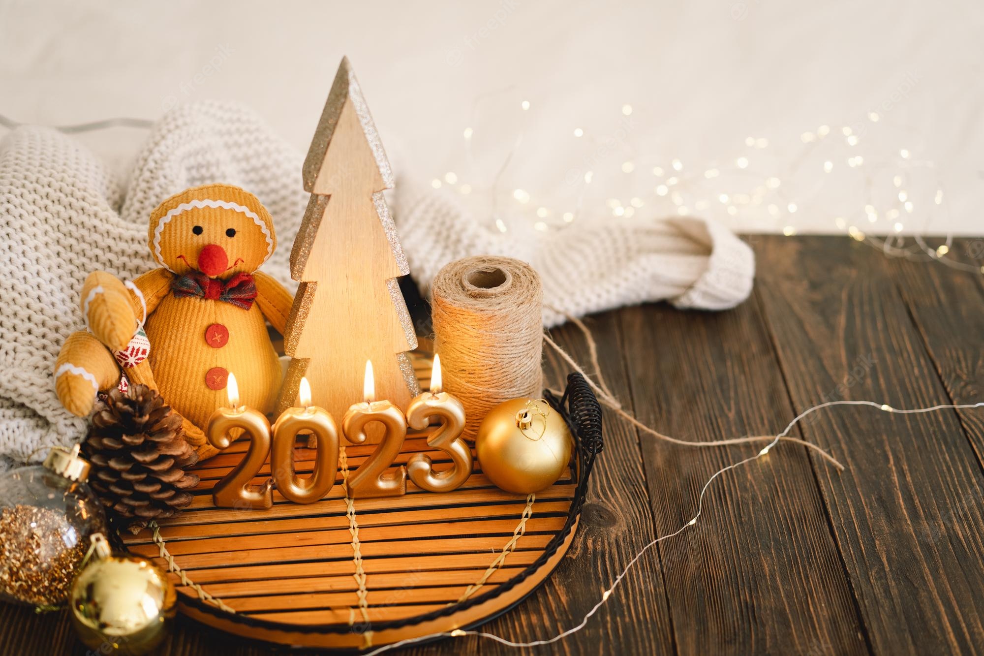 Premium Photo. Happy new years 2023 christmas background with fir tree cones and christmas decorations christmas holiday celebration new year concept