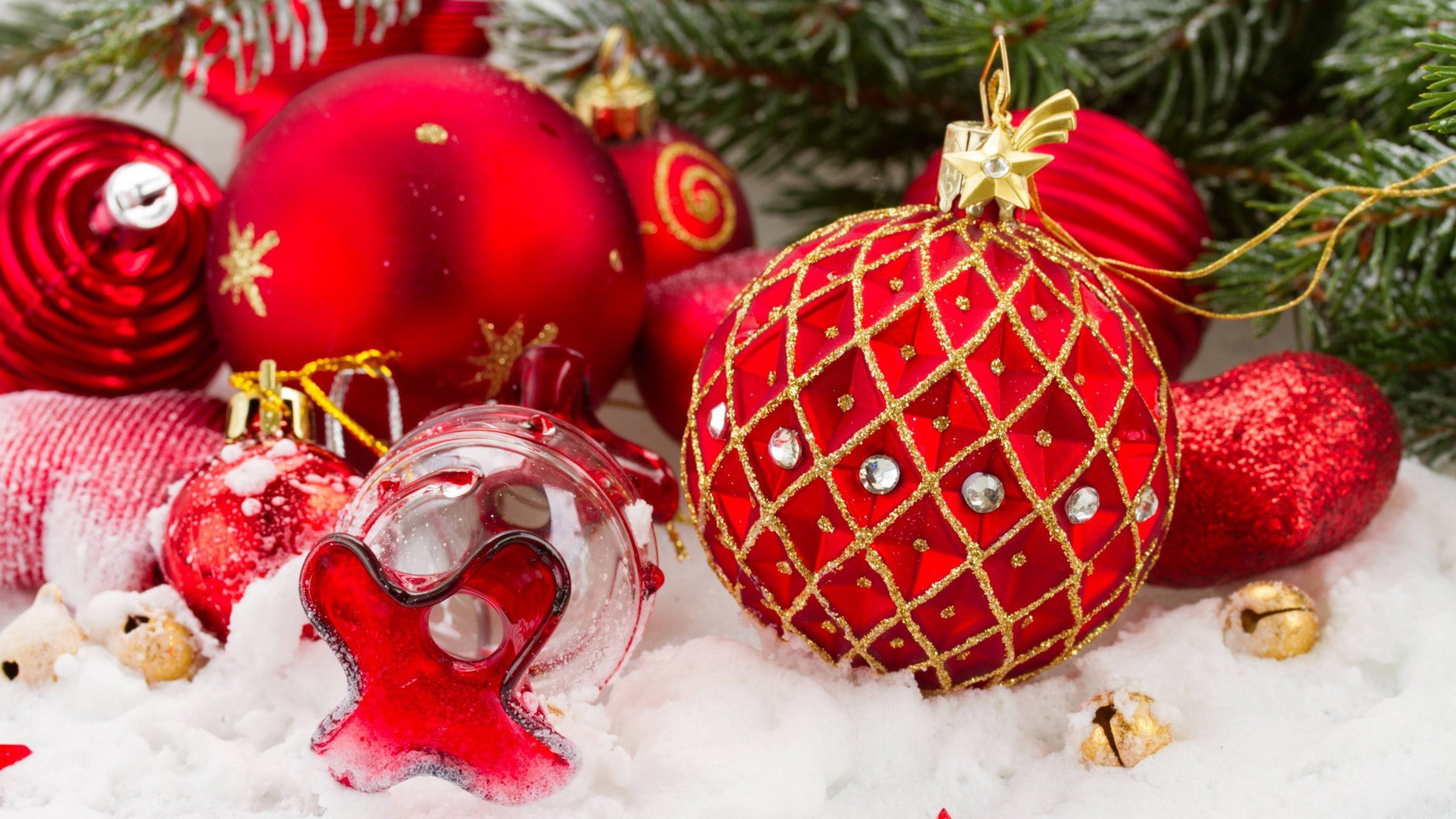 Download Red Aesthetic Christmas Balls In Snow Wallpaper