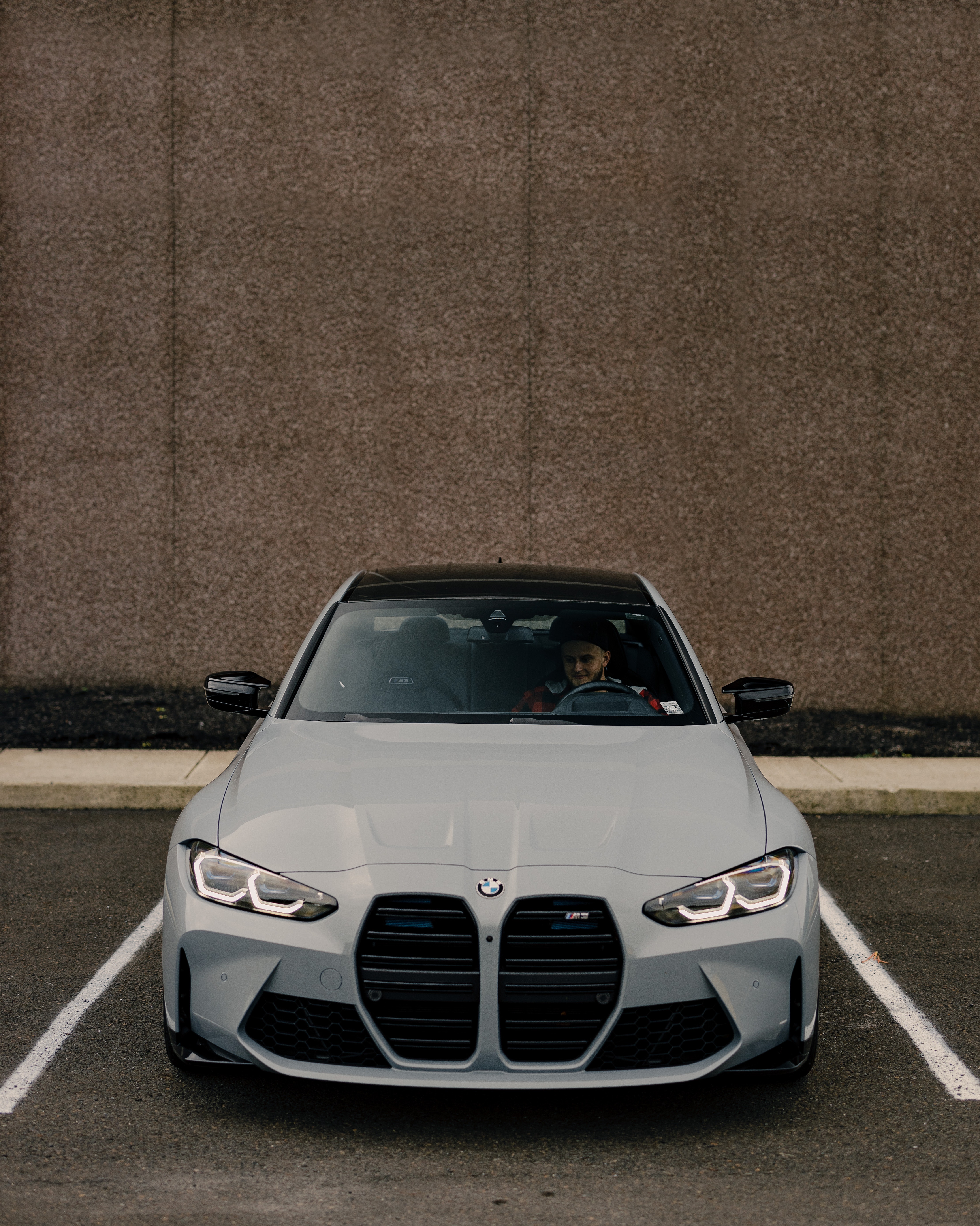 Man inside a Parked BMW G80 · Free