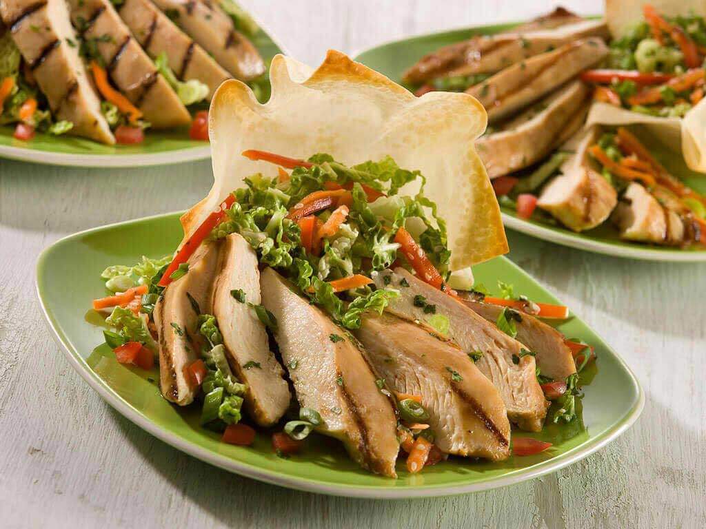 Teriyaki Chicken with Asian Slaw and Wonton Crisp. PERDUE®