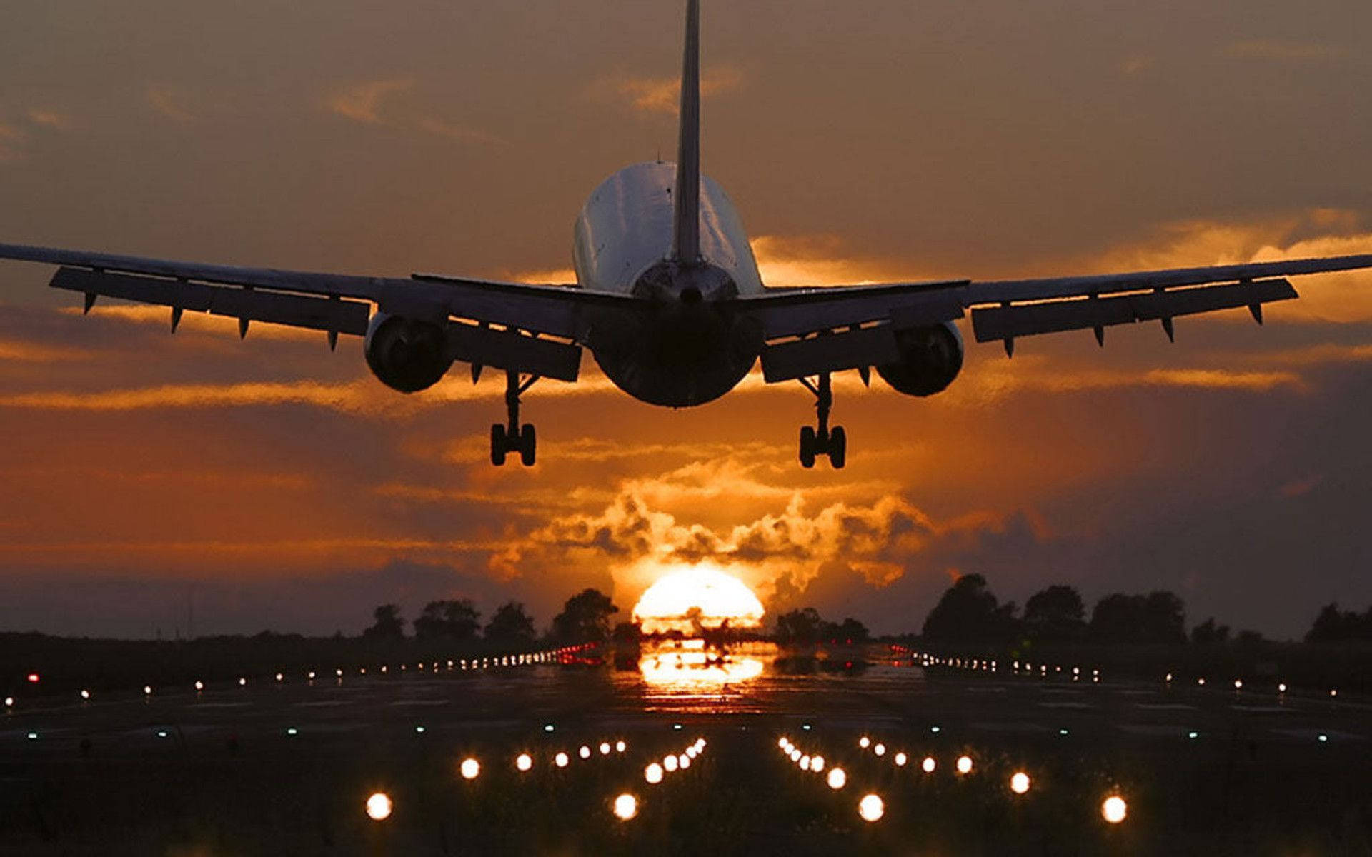 Download Sunset Landing Airplane Wallpaper