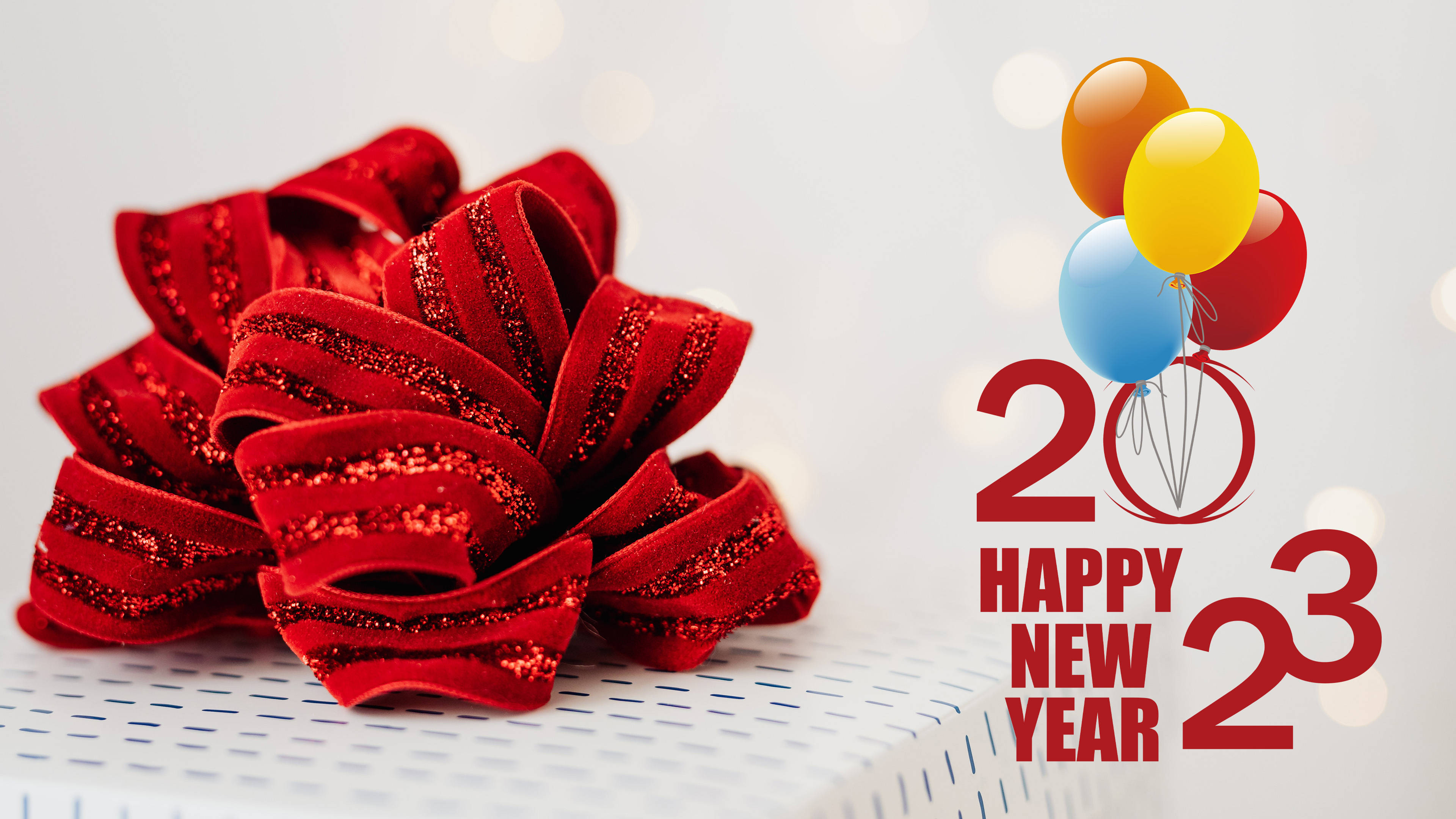 Download Wonderful Happy New Year 2023 Present Red Ribbon Wallpaper