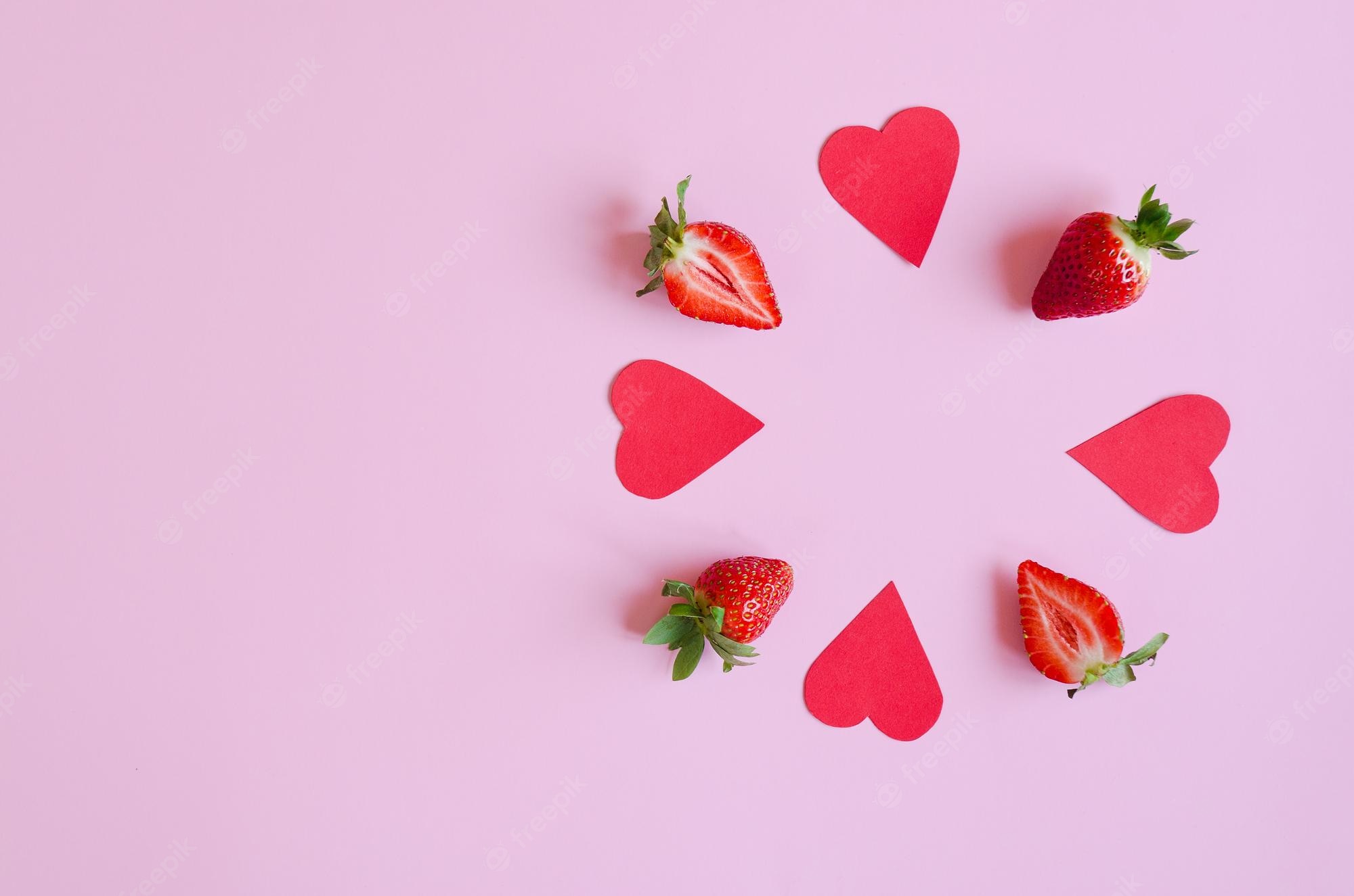 Premium Photo. Pink background. fresh strawberries in red gift boxes close up. love. valentine's day. creative