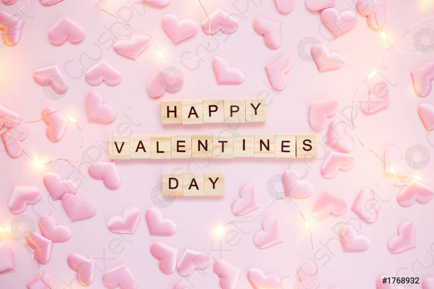Confetti heart and lights on a pink pastel background with