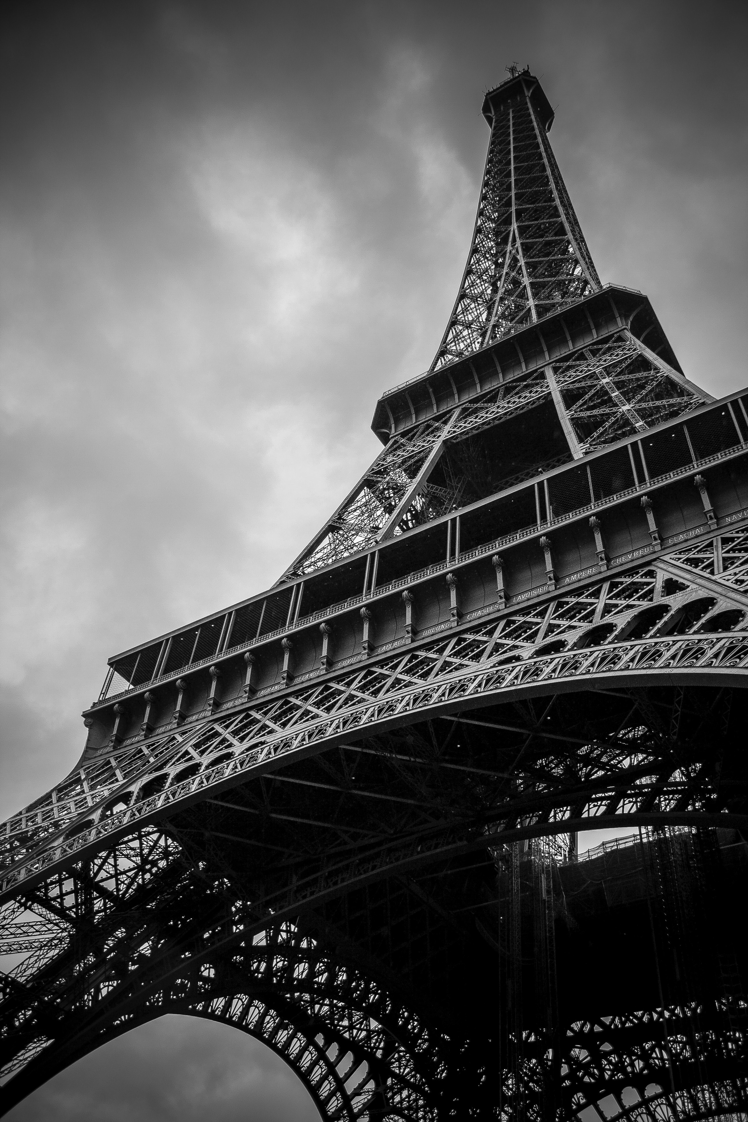 Wallpaper / a low angle shot of the eiffel tower in paris on a cloudy day, monochrome eiffel tower 4k wallpaper free download