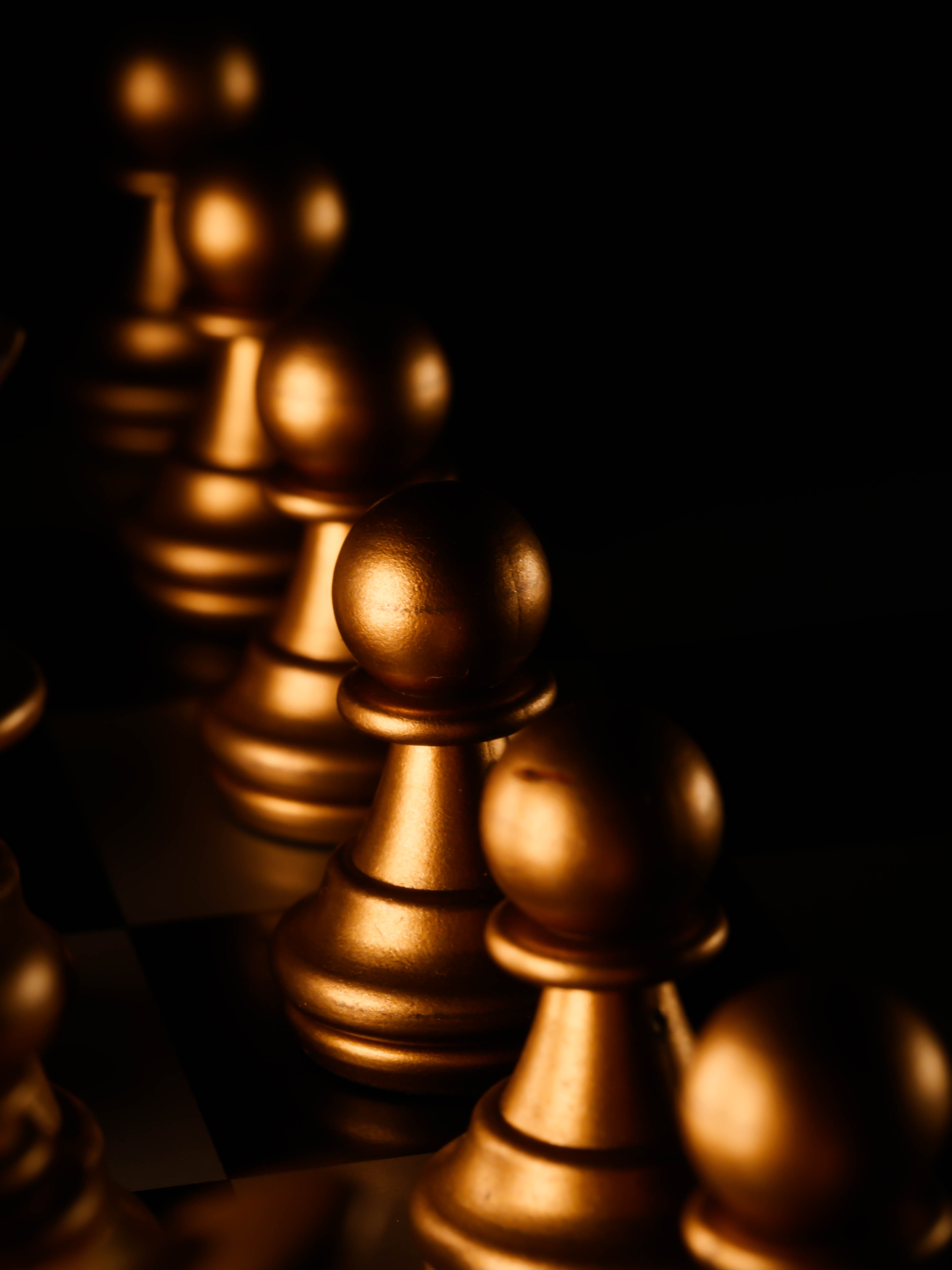 Gold Chess Piece on Black Surface · Free