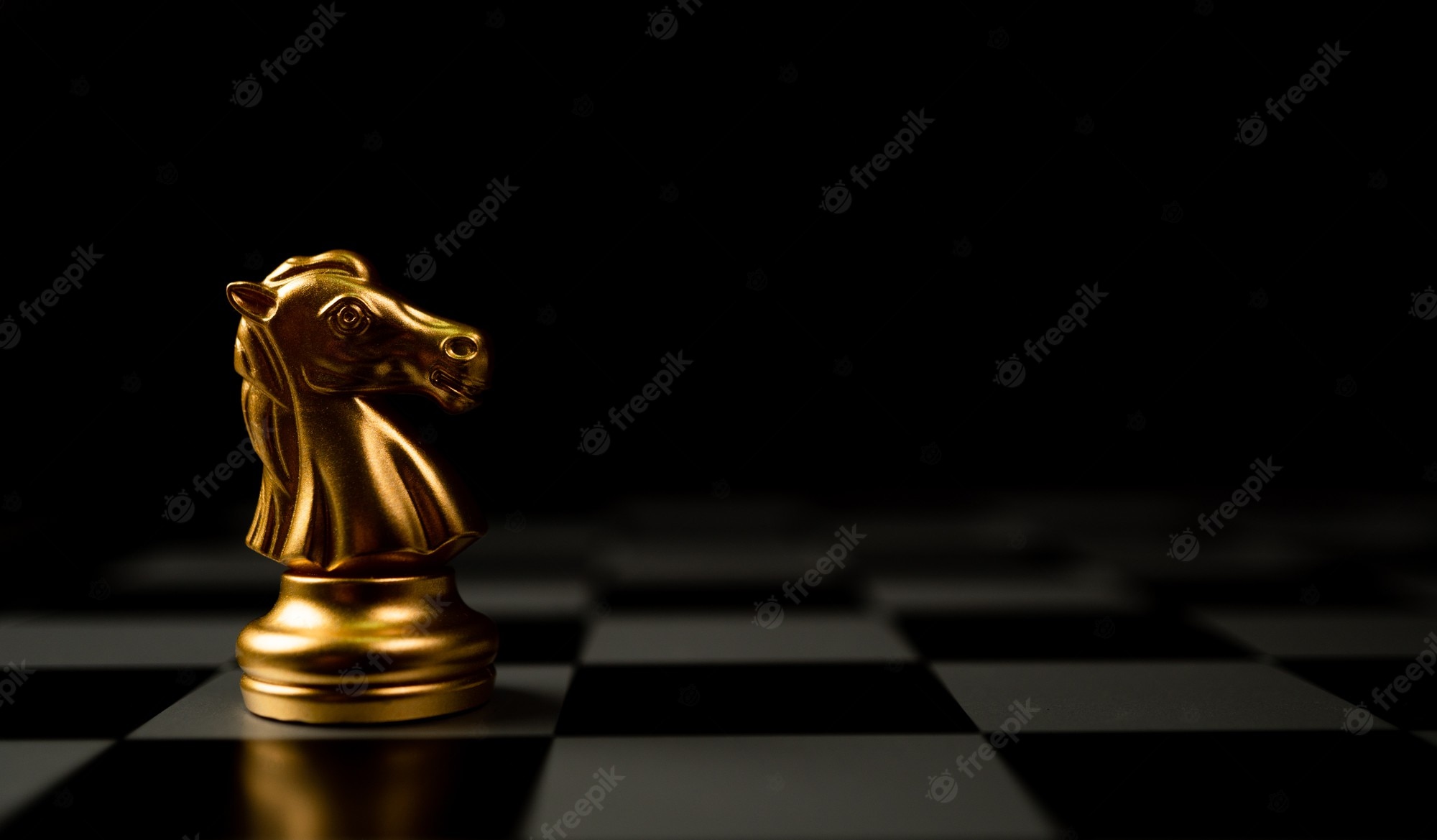 Premium Photo. Golden chess horse standing alone on the chessboard