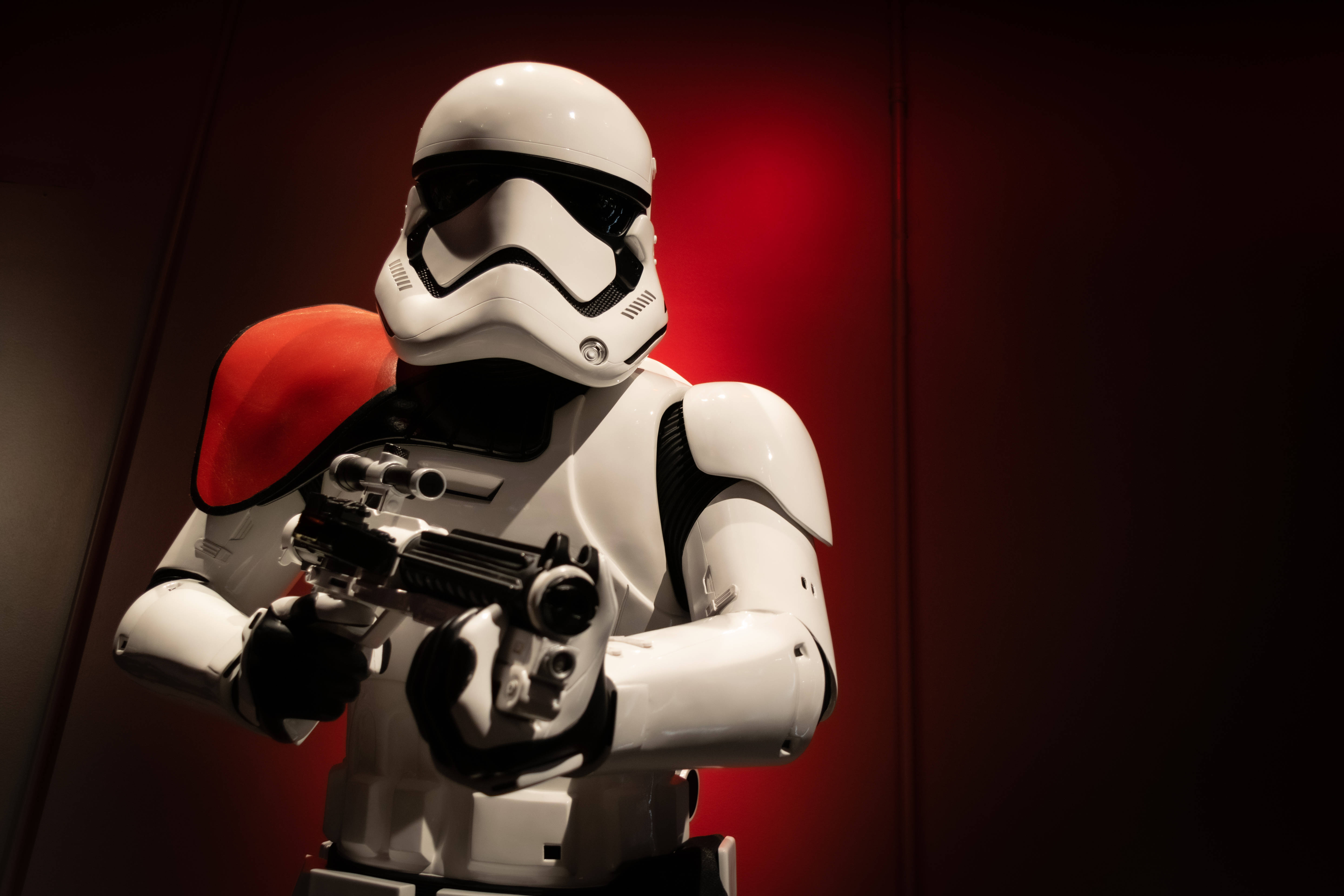 Download Epic Star Wars Stormtrooper Holding A Blaster Wallpaper