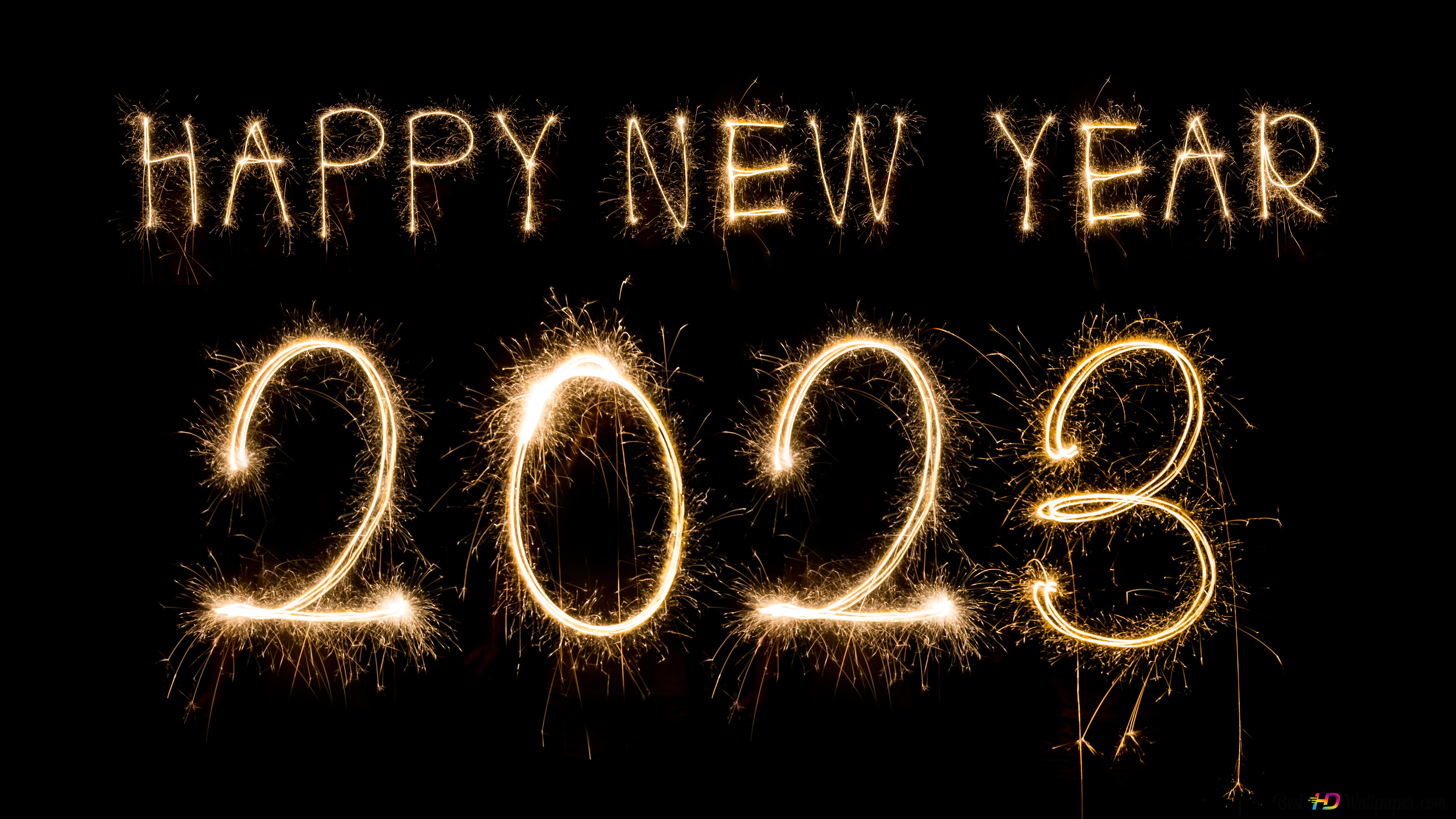 Happy new year 2023 written from fireworks black background 8K wallpaper download