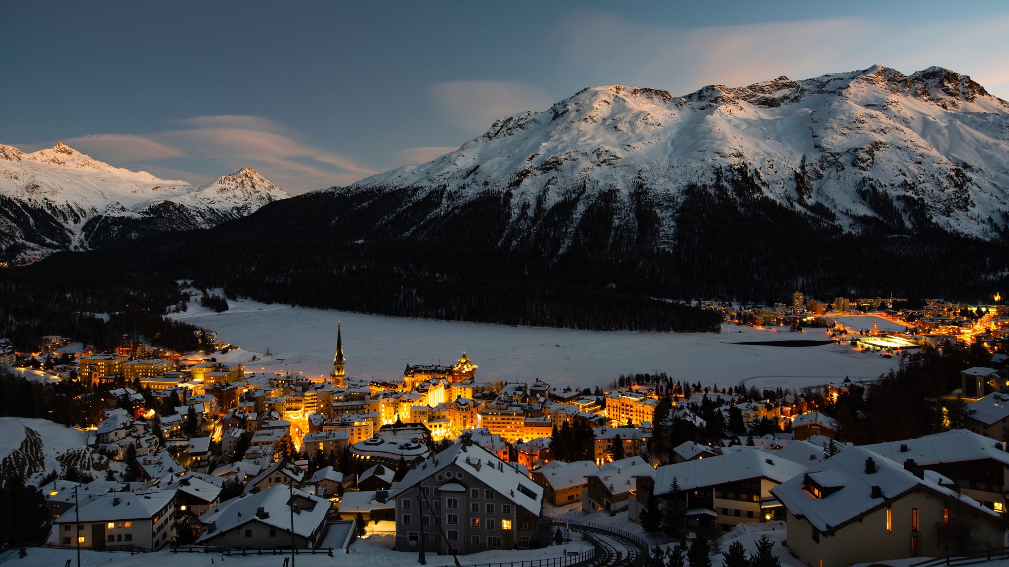 Download wallpaper 2048x1152 mountain, winter, village, snow, light, switzerland ultrawide monitor HD background