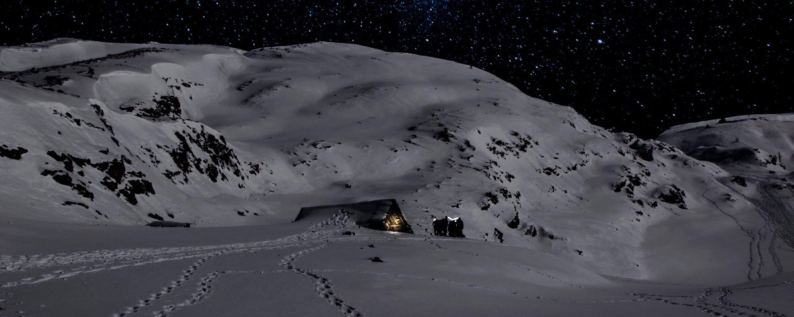 Download wallpaper 2560x1024 night, snow, mountains, footprints, winter ultrawide monitor HD background