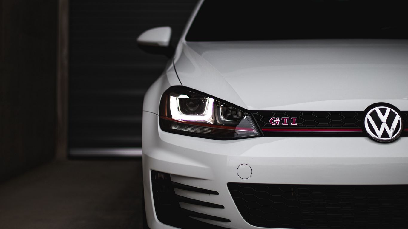 Download wallpaper 1366x768 volkswagen golf gti, volkswagen, car, white tablet, laptop HD background