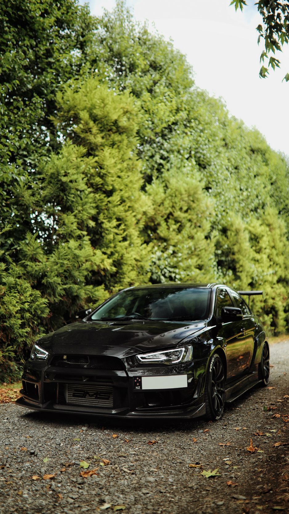 Download Wallpaper 938x1668 Mitsubishi Lancer Evolution, Mitsubishi, Black, Front View Iphone 8 7 6s 6 For Parallax HD Background