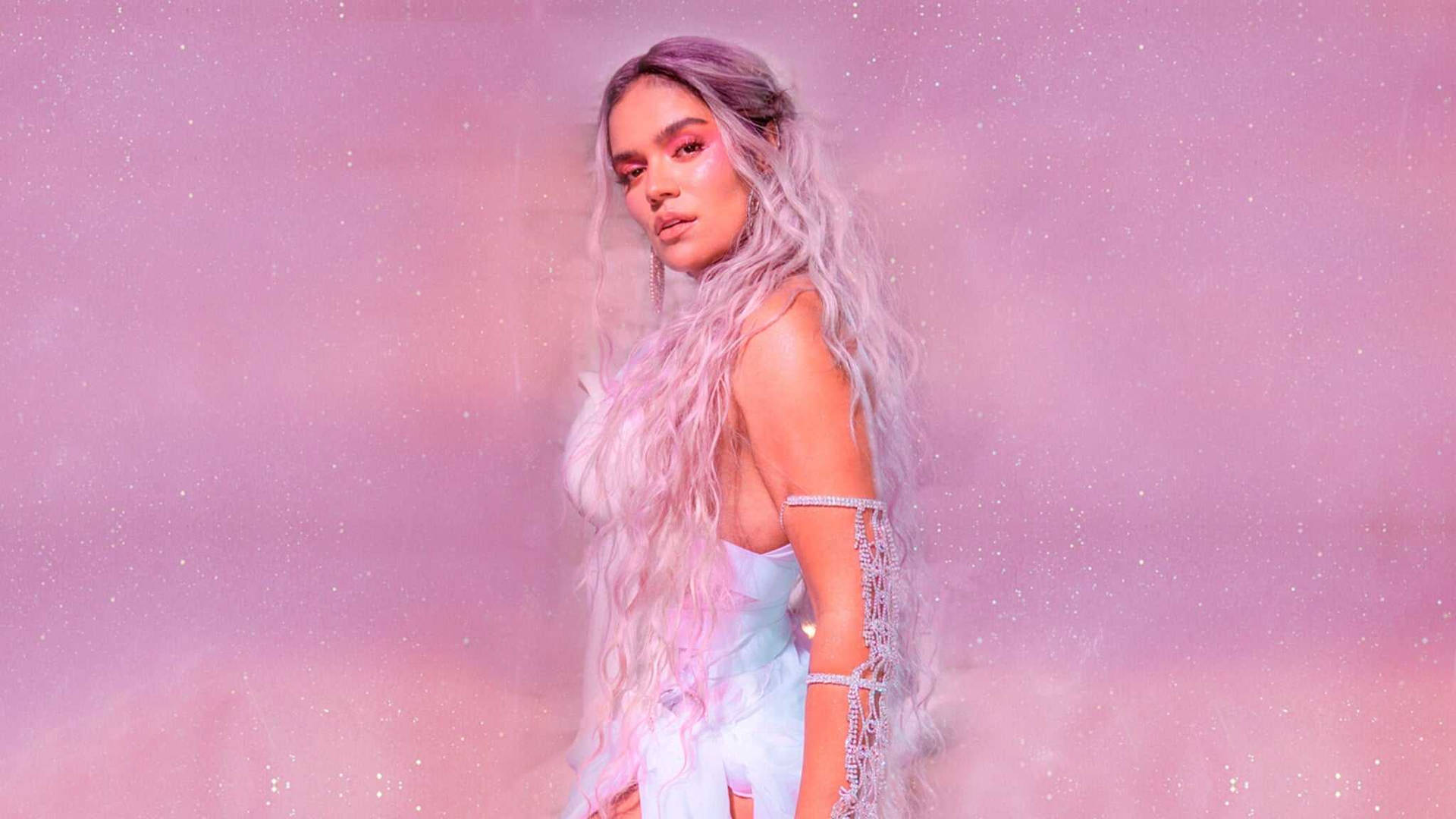 Karol G Promises New Music With Steamy Pics In Pink Bra and Miniskirt