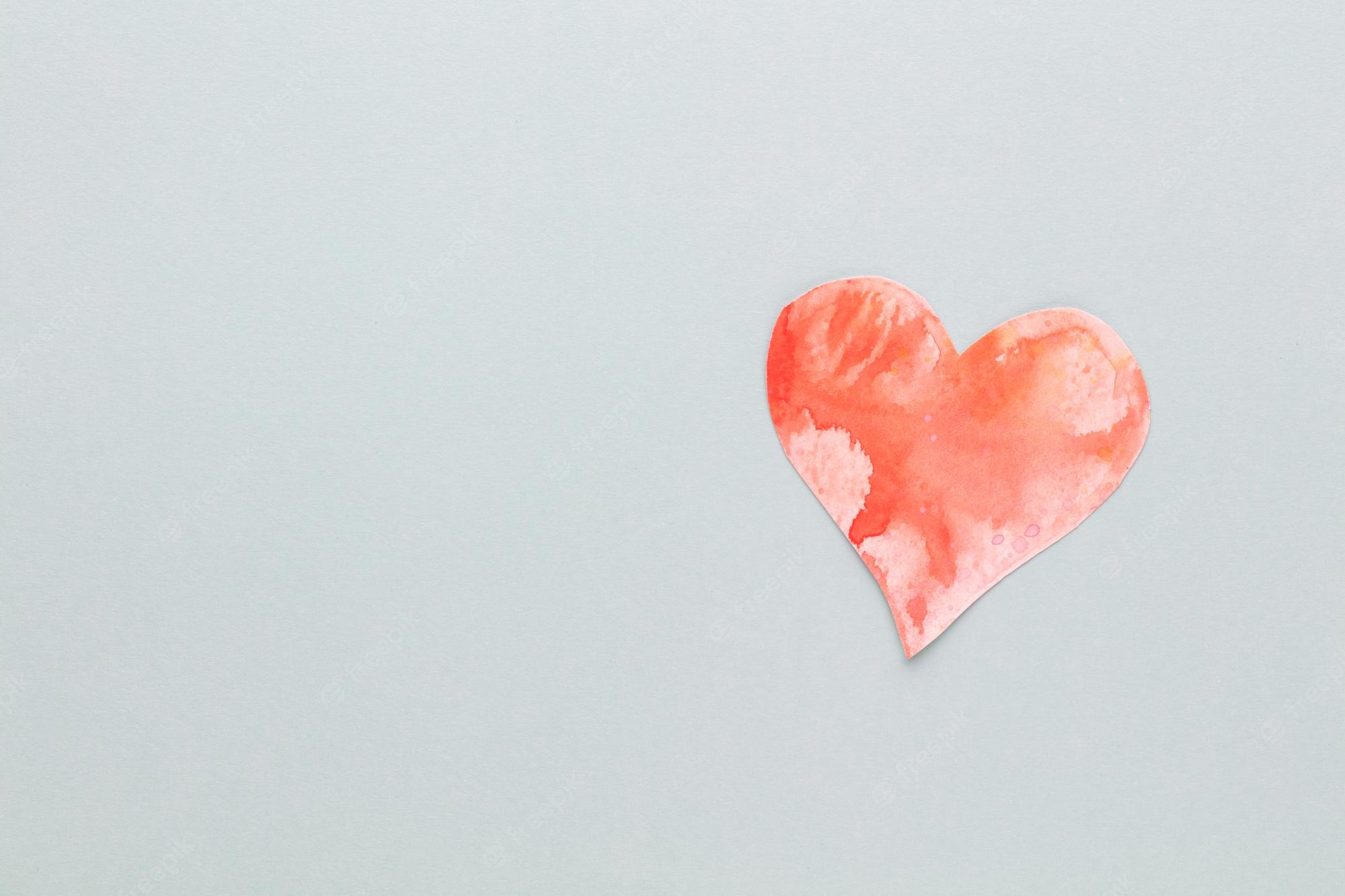 Premium Photo. Cut the heart shaped paper, put on a pastel background. valentine's day concepts