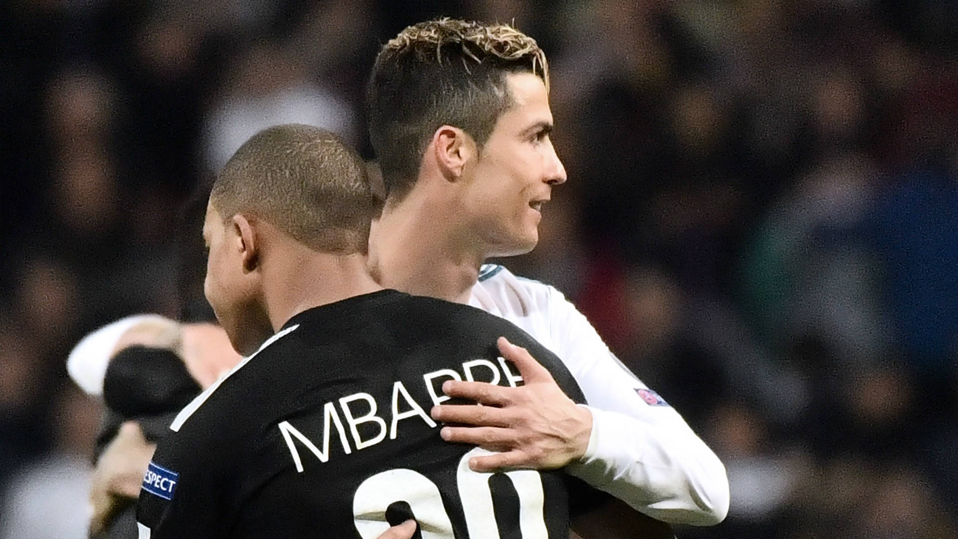 Download Kylian Mbappe Hugging Cristiano Ronaldo Wallpaper