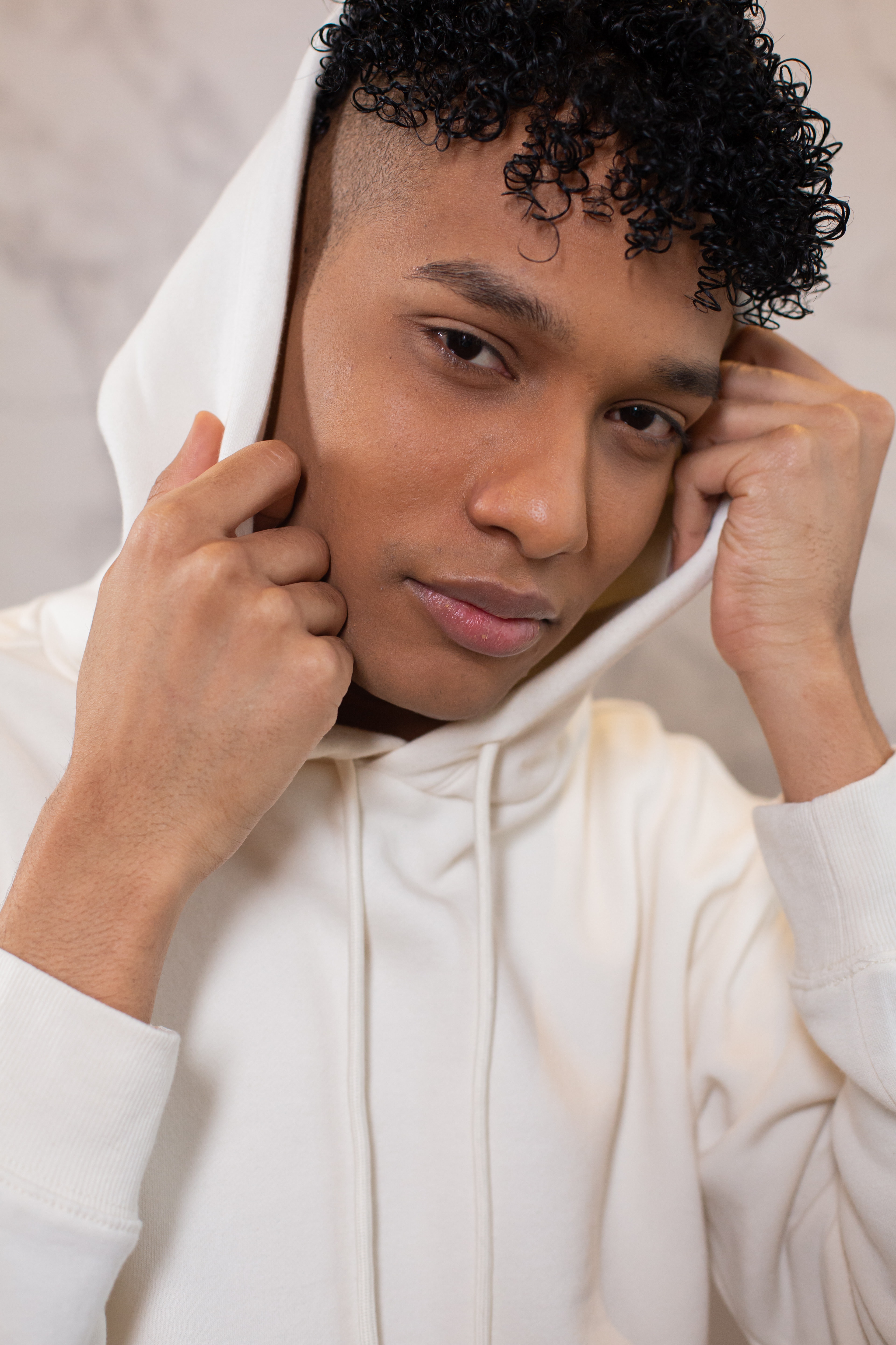 Black man with curly hair in hood · Free