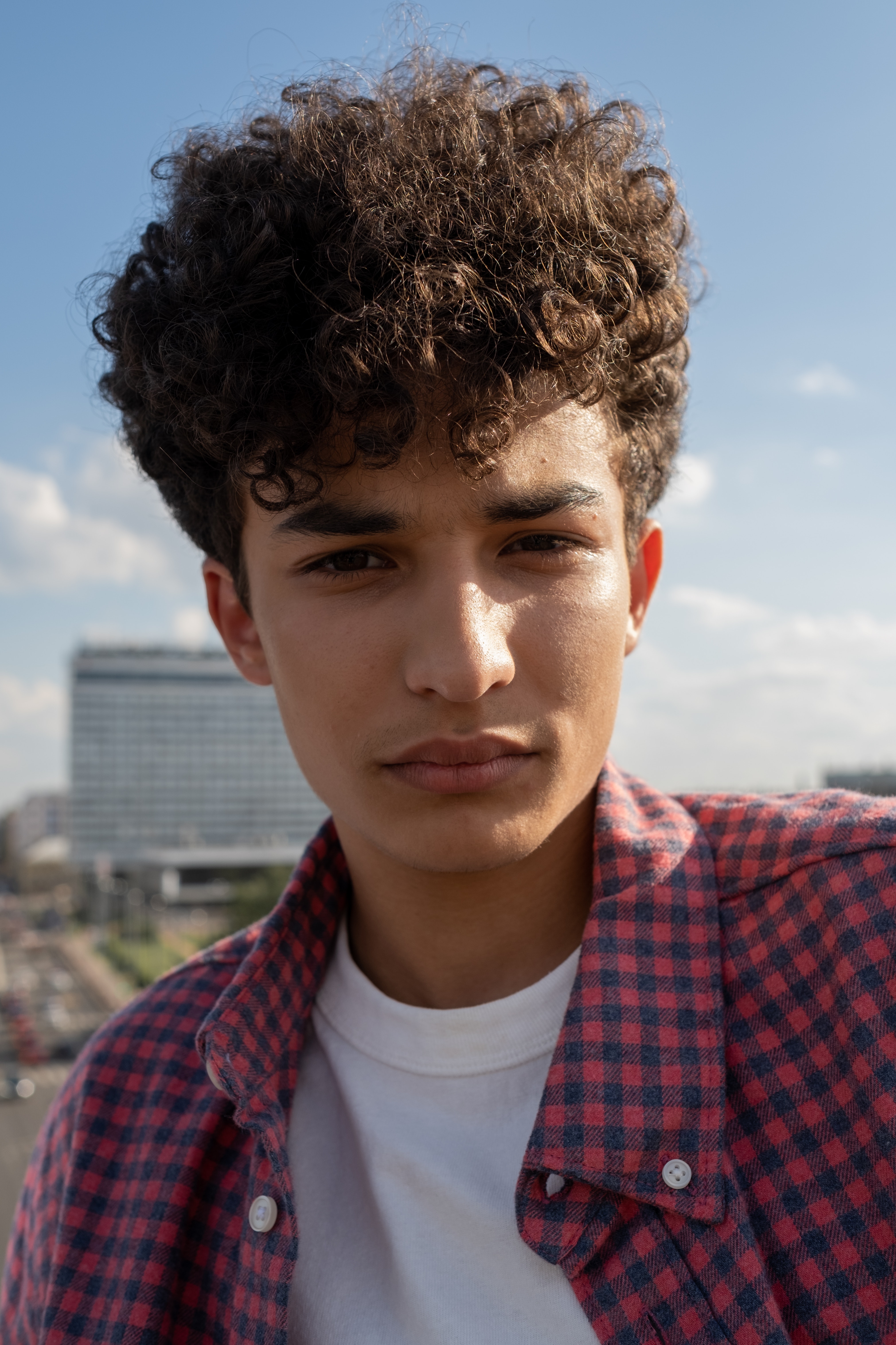 Portrait of teenage boy with curly hair · Free