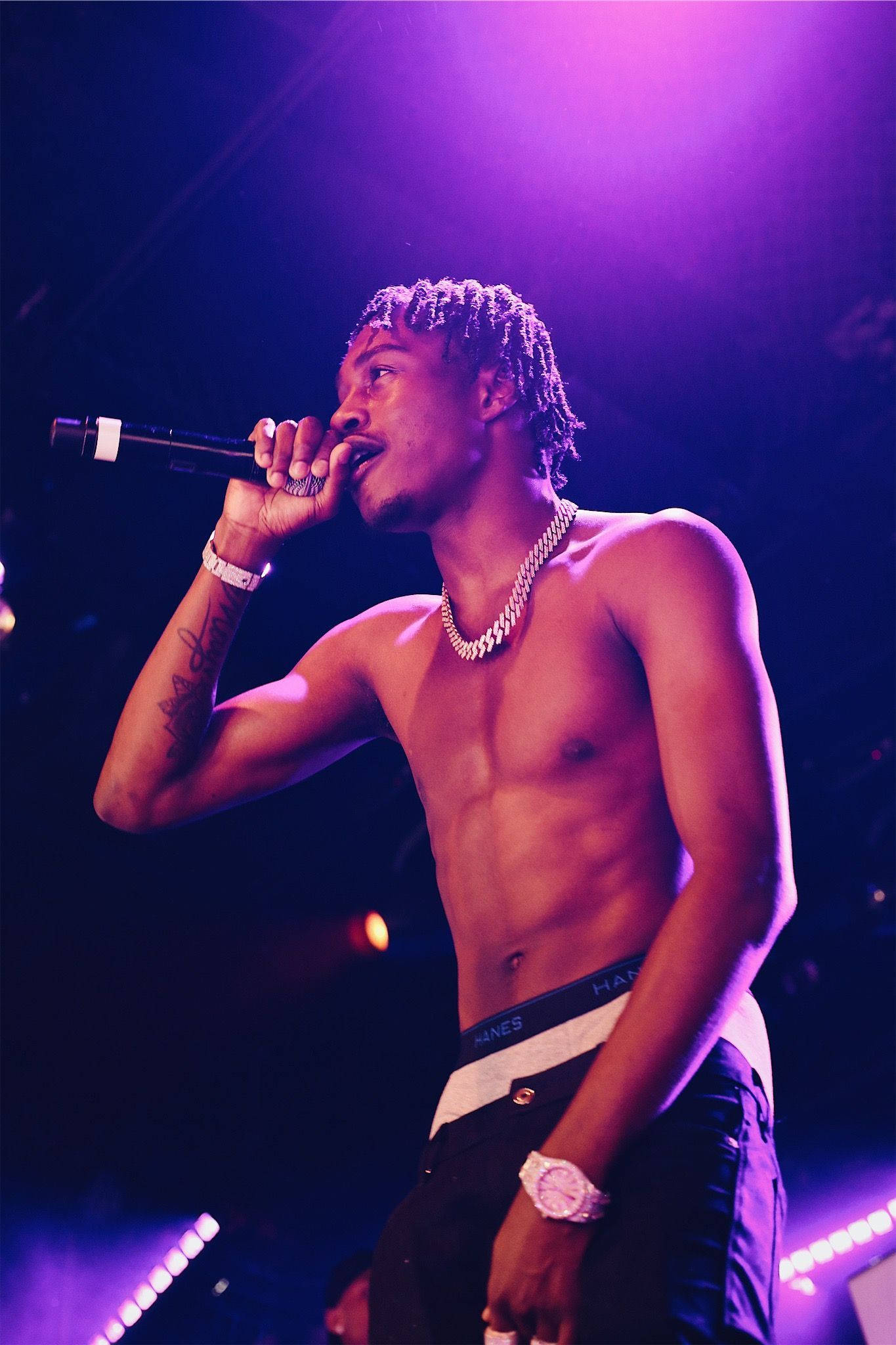 Download Rapper Lil Tjay Purple Lights Wallpaper