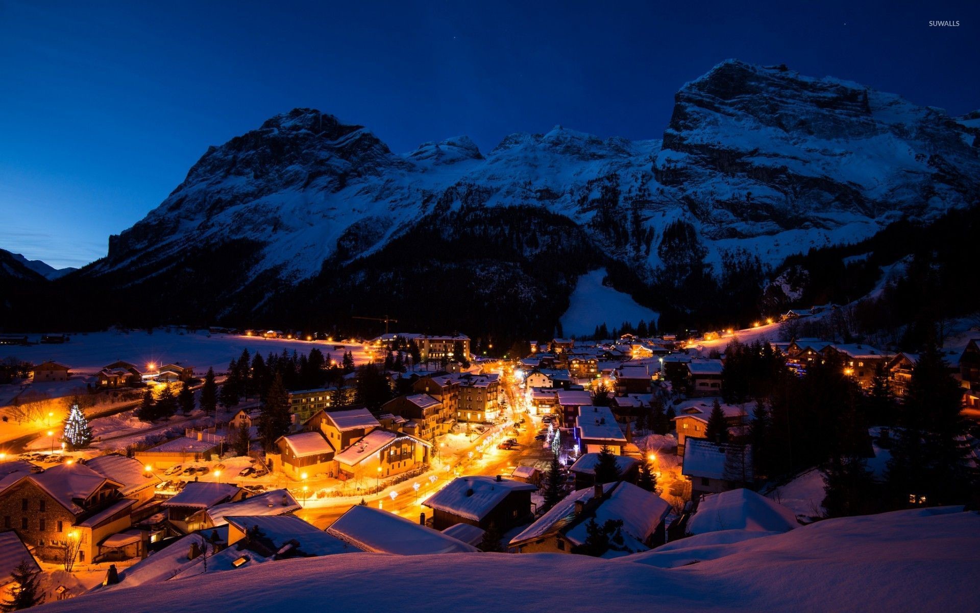 Night lights in the snowy mountain town wallpaper