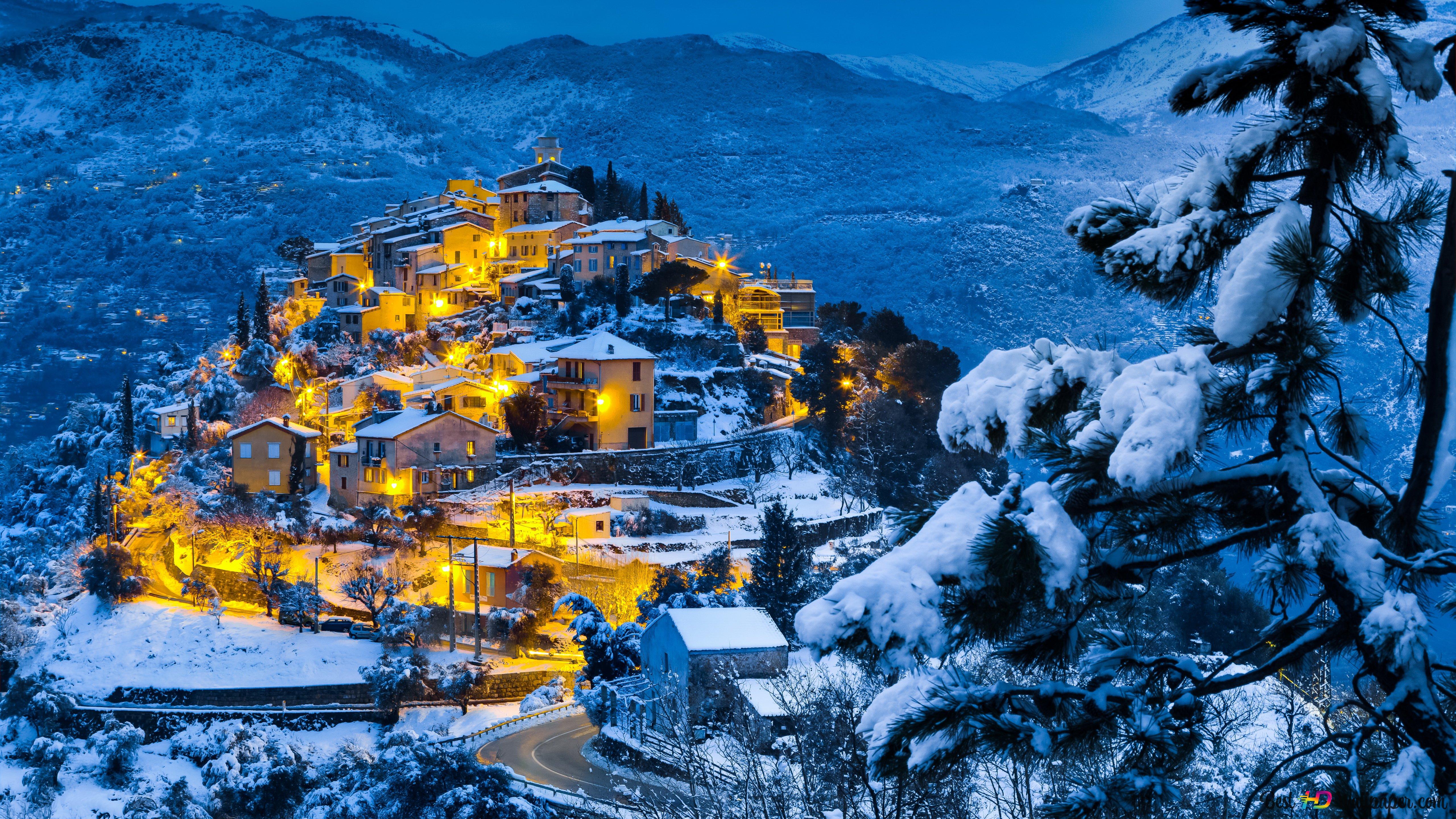 Cozy village on a snowy hill 4K wallpaper download