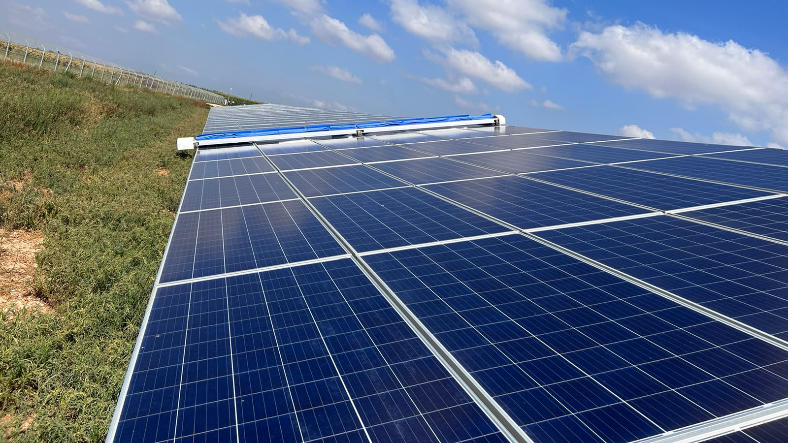 Robots that clean solar panels without water