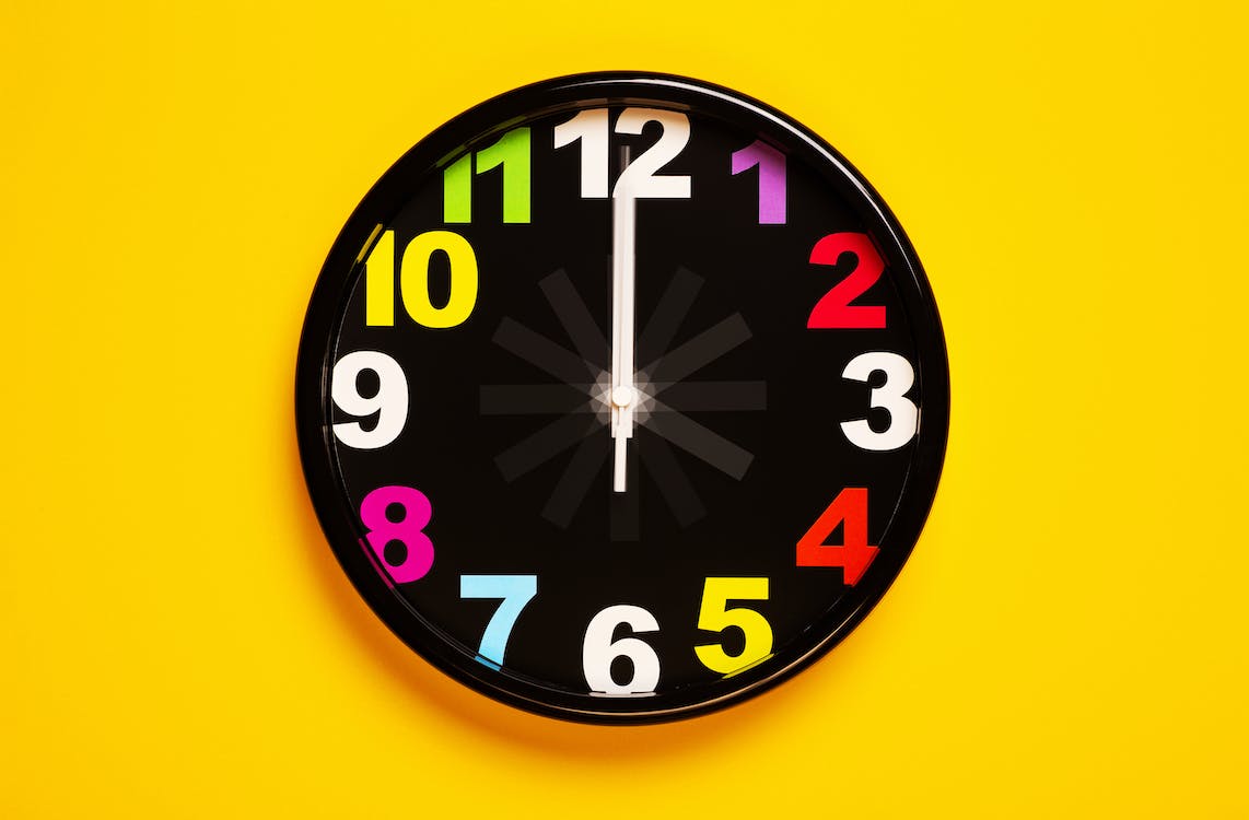 Black and Yellow Analog Clock · Free