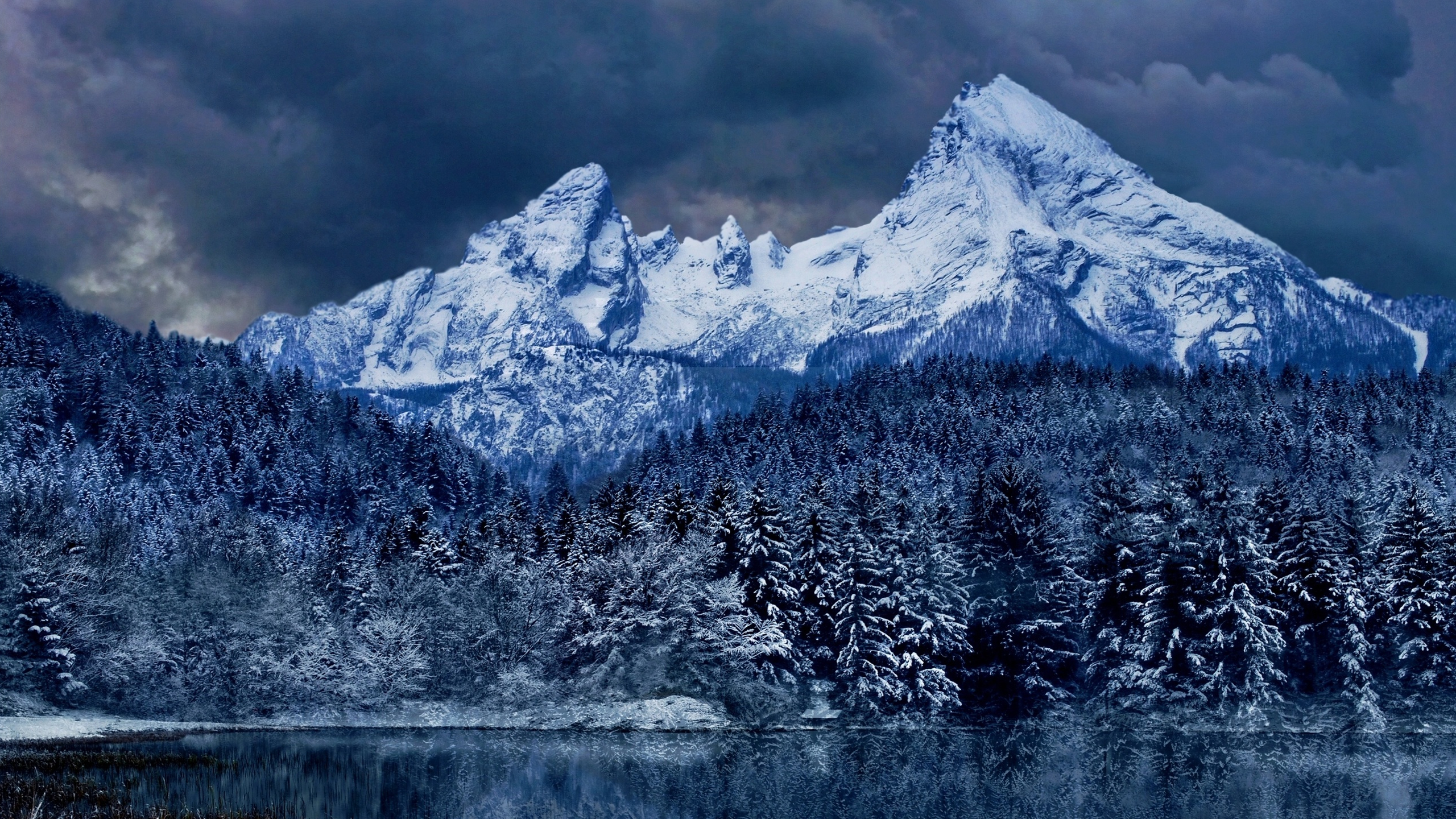 Dark Clouds over Winter Mountain and Forest