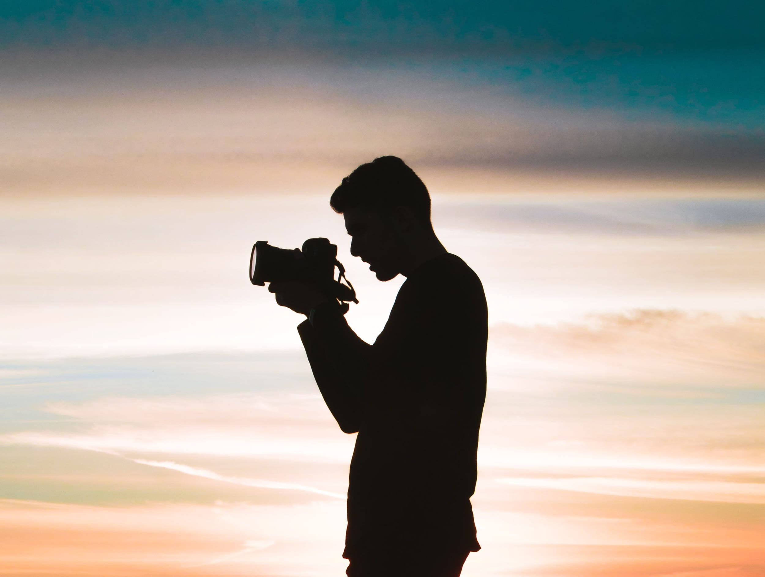 Download Silhouette Man With Camera Wallpaper