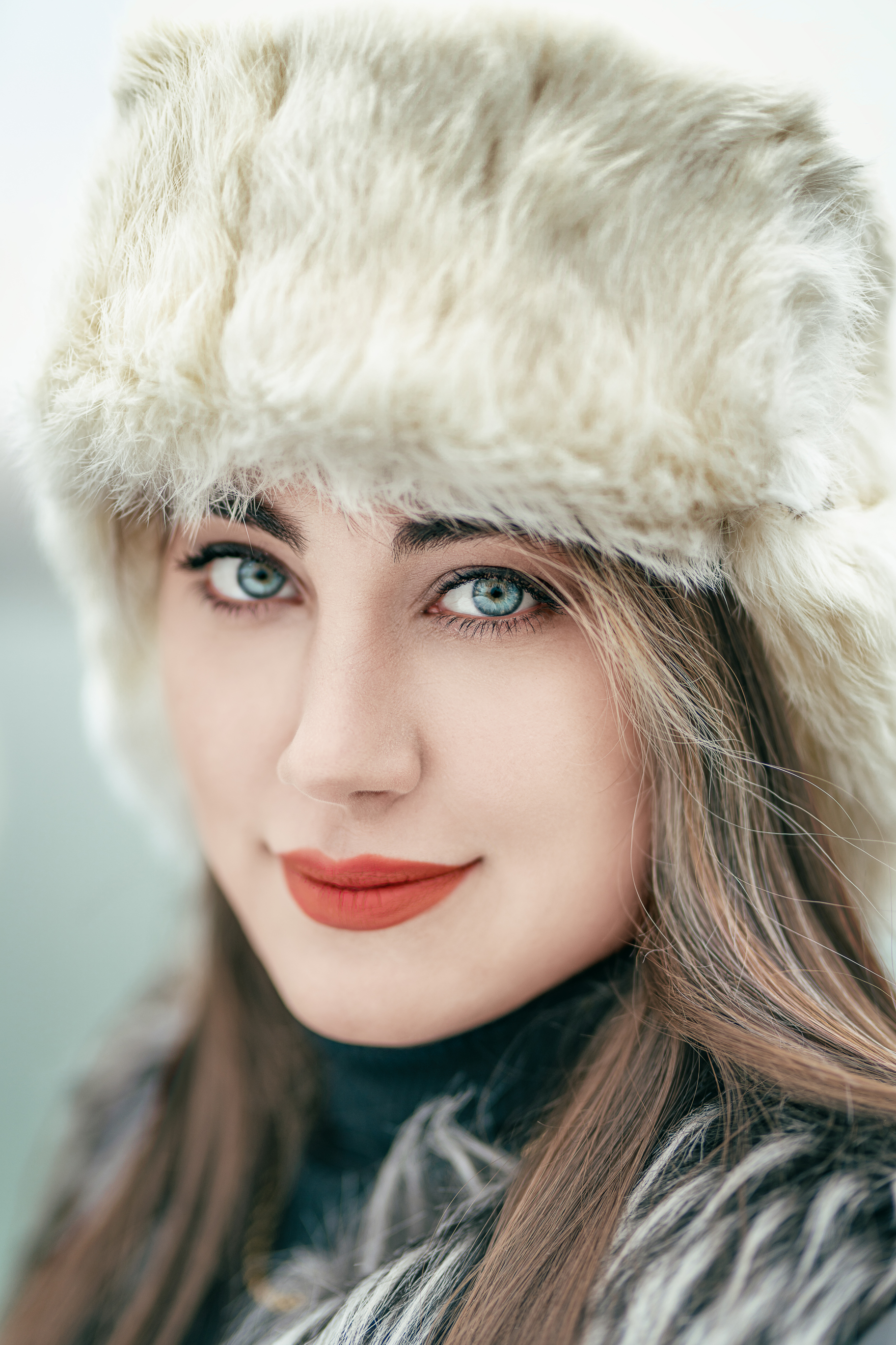 A Beautiful Woman Wearing an Ushanka Hat · Free