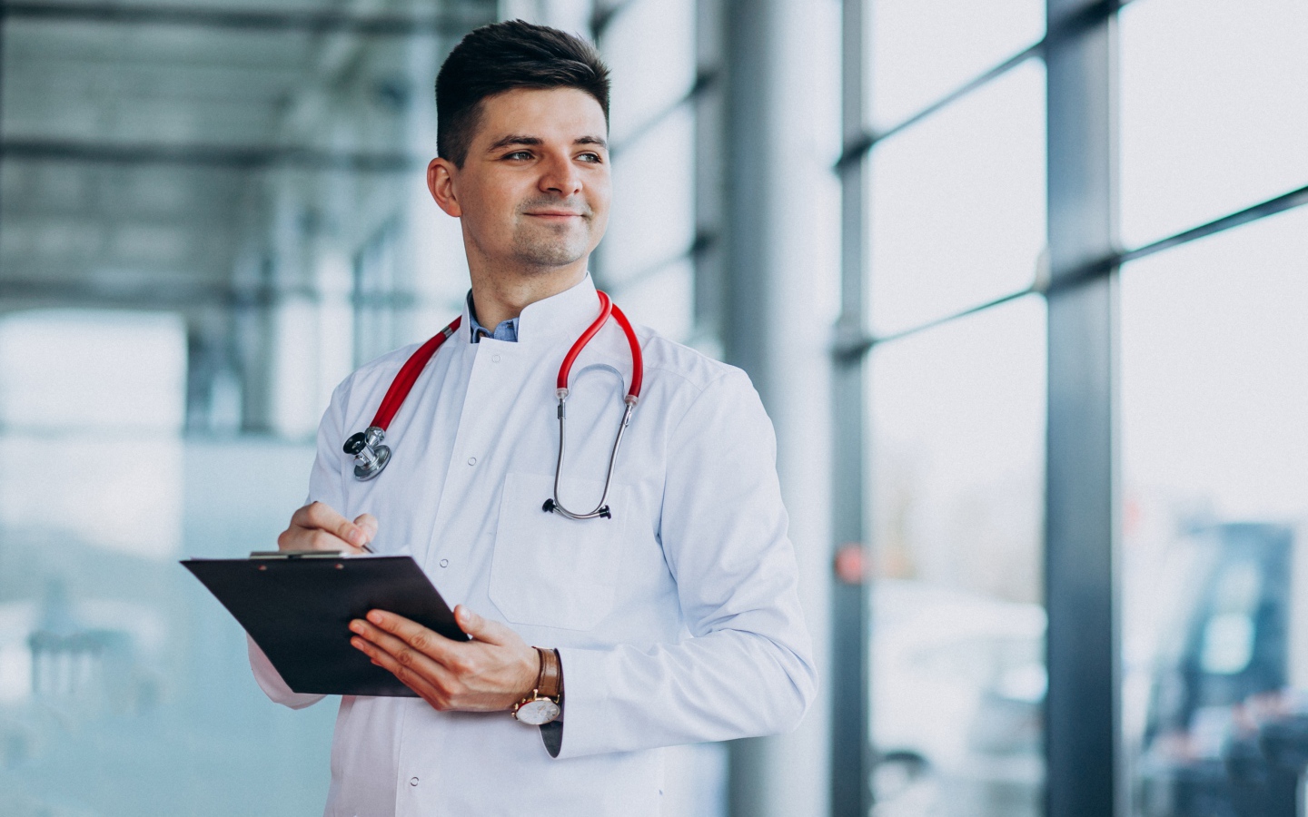 Male doctor in the hospital by the window Desktop wallpaper 1440x900