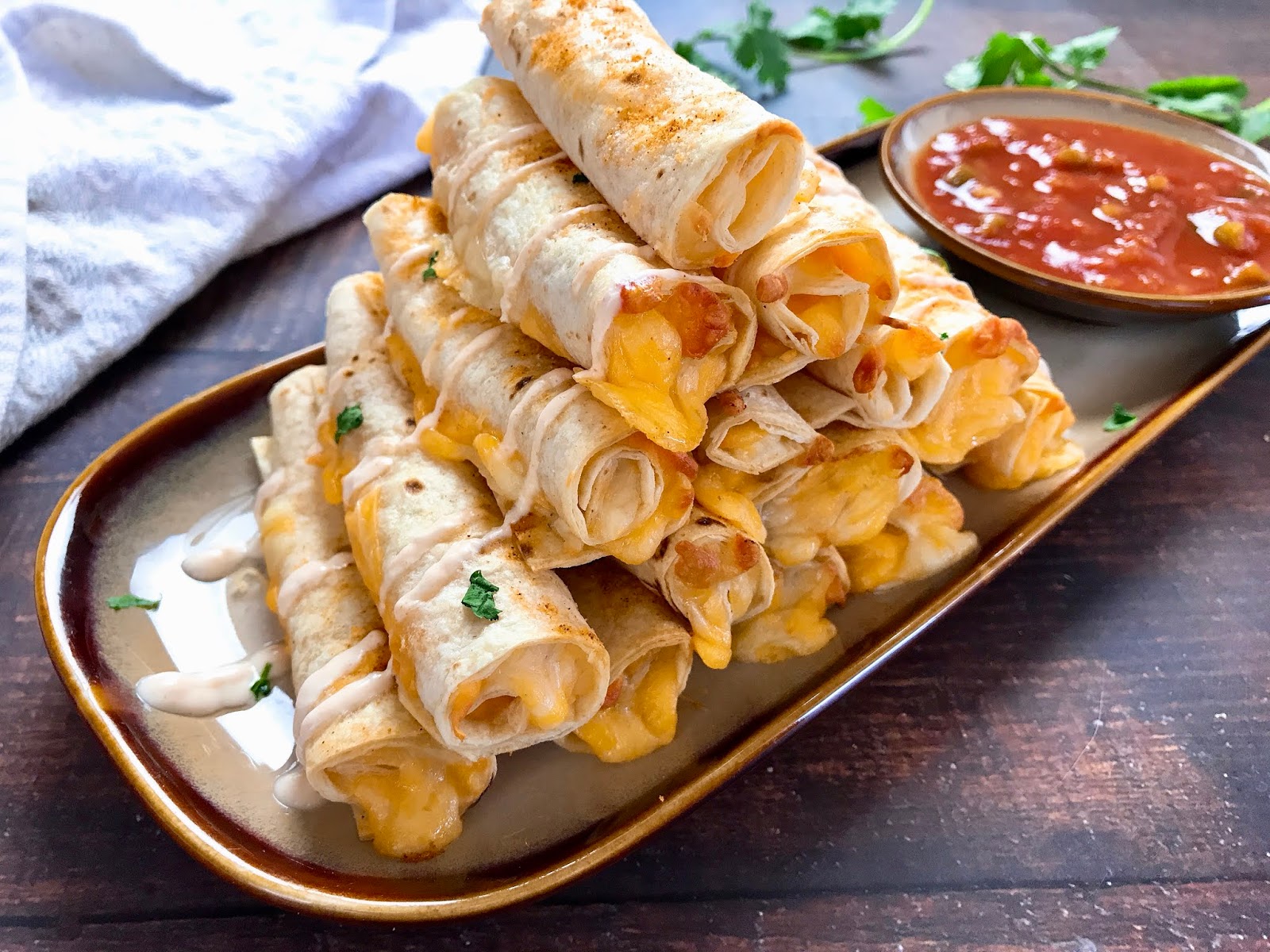 Baked Cheese Taquitos with Spicy Sour Cream